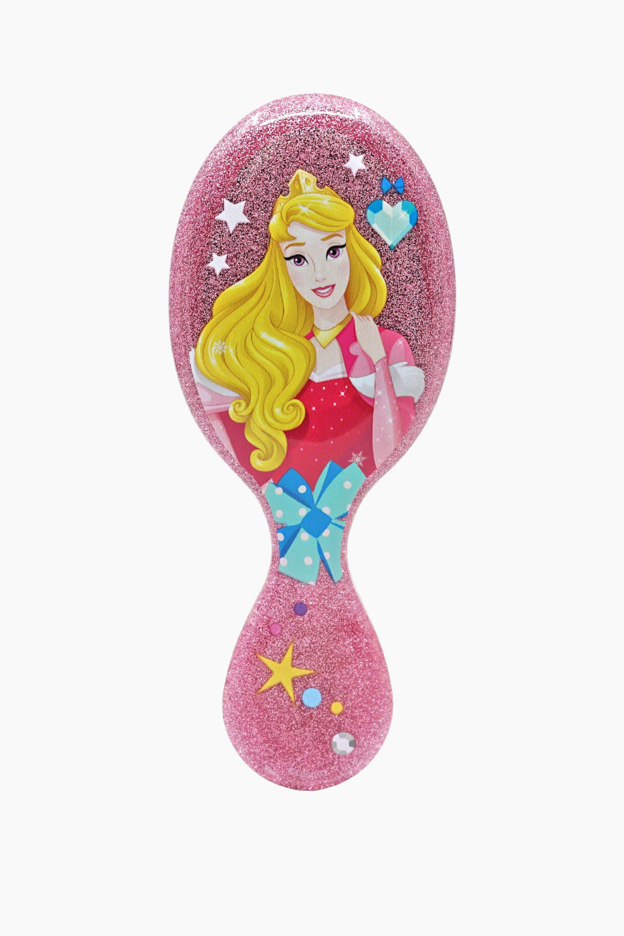 Se større billede: En hårbørste med et ovalt hoved og et skaft, alt sammen glitrende med pink glitter. Hovedet viser en blond prinsesse iført en guldkronе og en pink kjole, med hvide stjerner og en blå hjerteformet ædelsten, mens skaftet er dekoreret med en blå sløjfe, en gul stjerne og forskellige farverige prikker.