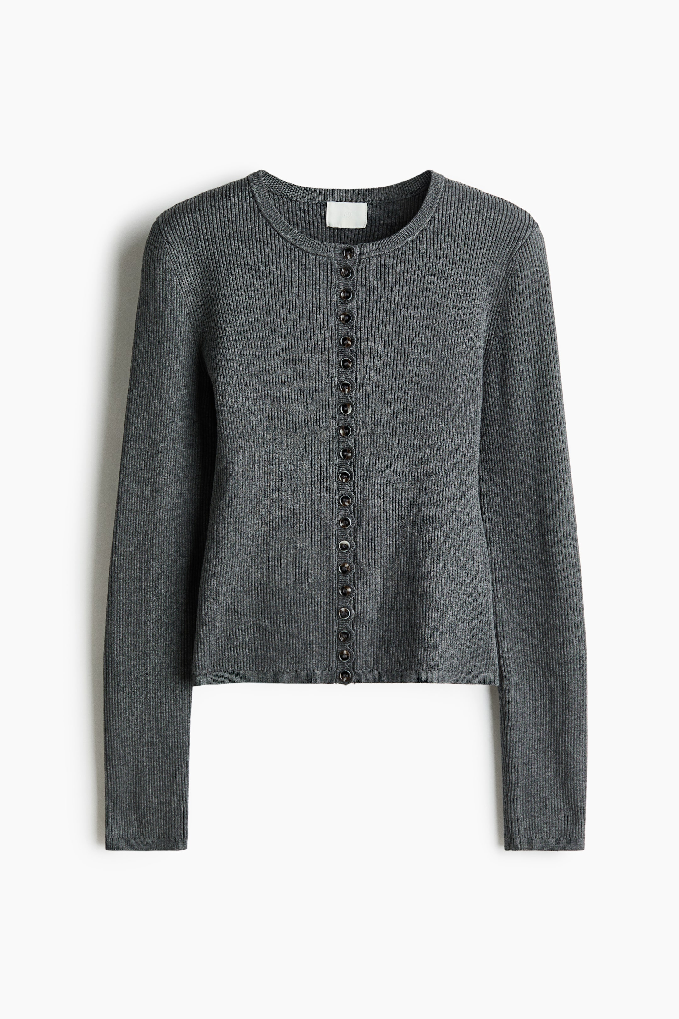 View larger image: A short, fitted cardigan is displayed FRONT, showcasing a soft rib knit, a round rib-trimmed neckline, and a scalloped button band with dark buttons running down the front. It features long sleeves with narrow, ribbed cuffs and a narrow, ribbed hem.