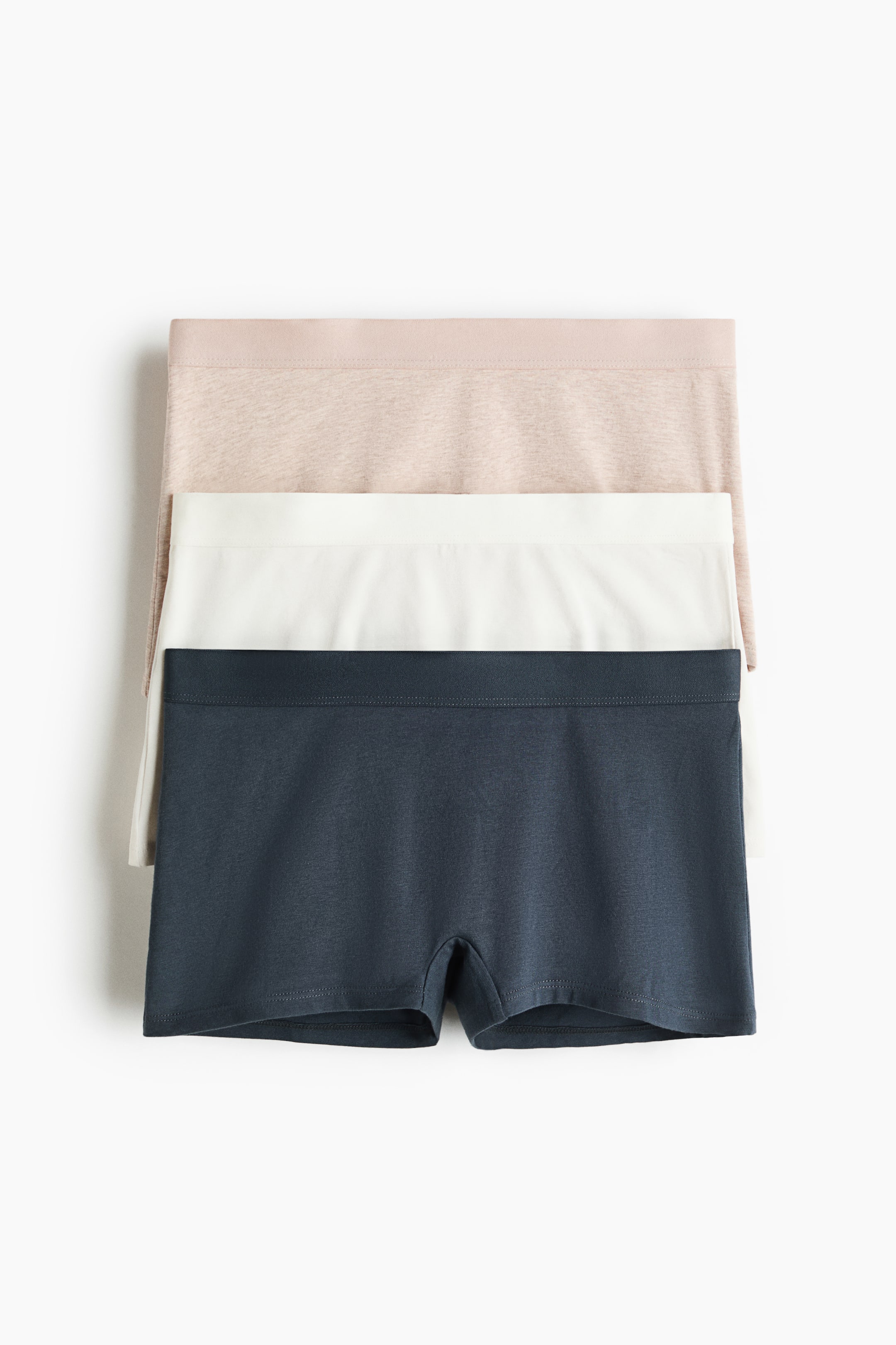 View larger image: A set of three boxer briefs is shown, highlighting their front view. These cotton jersey briefs feature a mid-rise waist and a lined gusset, available in beige, white, and charcoal gray.
