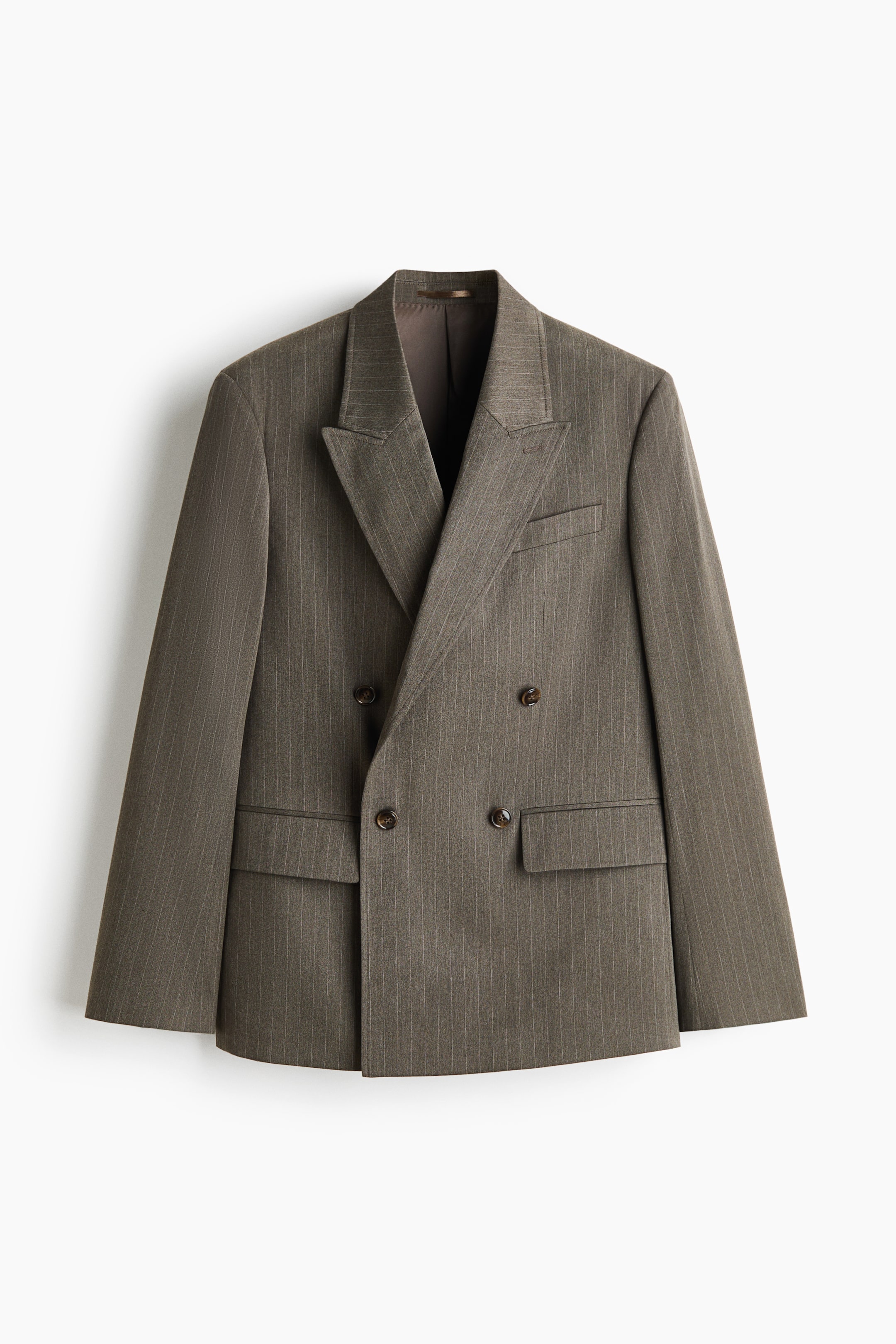 View larger image: A double-breasted blazer in a taupe-brown pinstripe pattern is hanging front-facing, showcasing peak lapels and a four-button closure. The structured design features two front flap pockets and a single welt chest pocket.