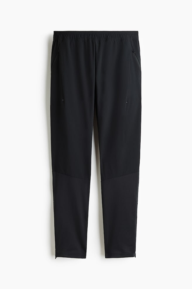 Regular Fit Tapered sports trousers with DryMove™ - Black - 1