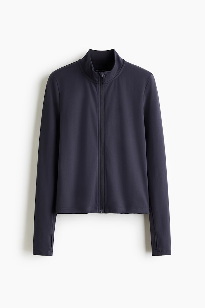 A dark gray zip-through sports jacket is displayed flat, featuring a stand-up collar and a full-length black zipper down the front. The long sleeves are including thumbholes at the cuffs. - 1