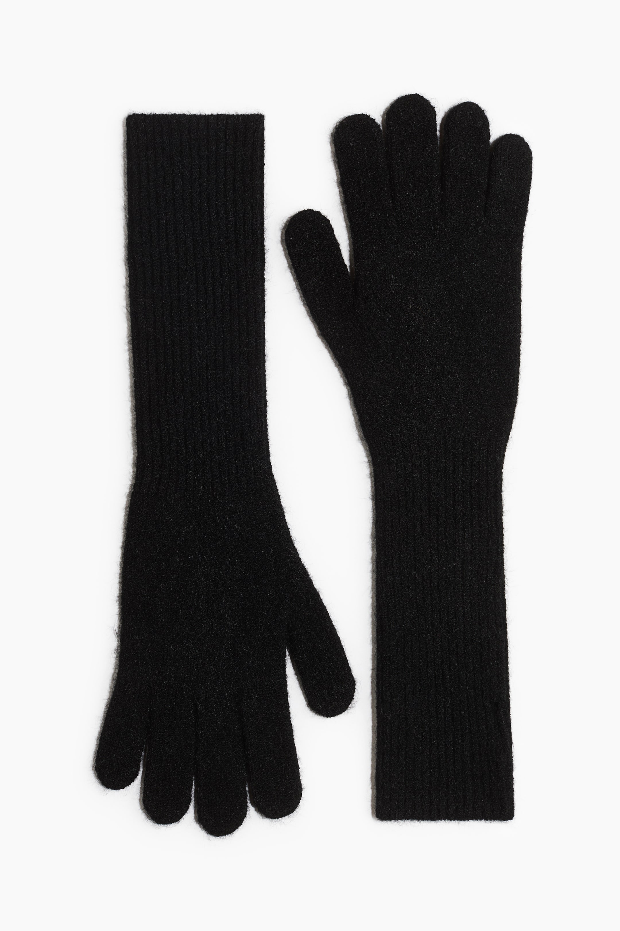 View larger image: A pair of long black knit gloves is laid flat, featuring extra-long ribbed cuffs and a soft, textured finish. One glove is pointing upward while the other is pointing downward, showcasing the extended sleeve design and full-finger coverage.