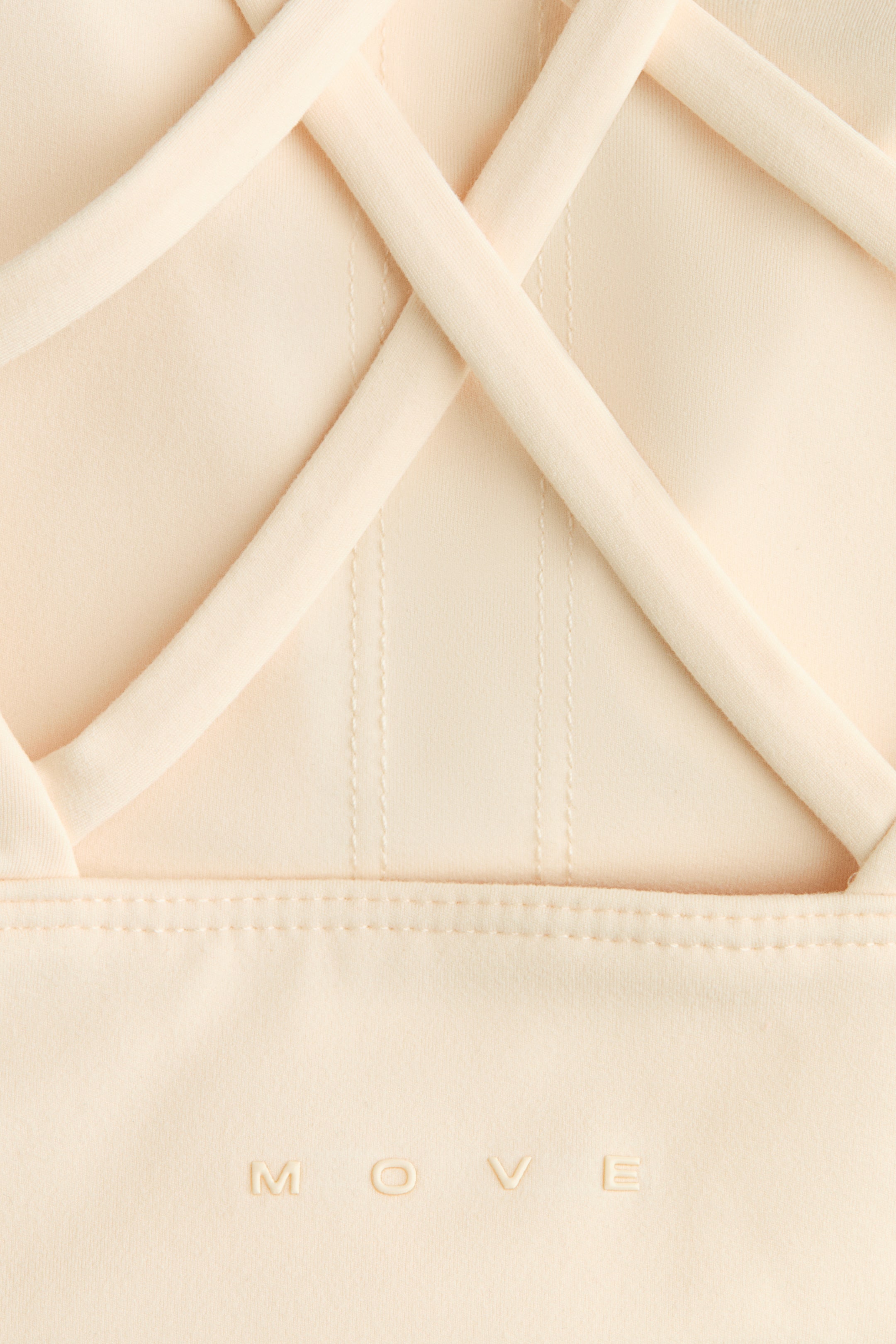 Ampliar la imagen: Top deportivo Medium Support con SoftMove™ - Chabacano claro - Ladies | H&M MX 2