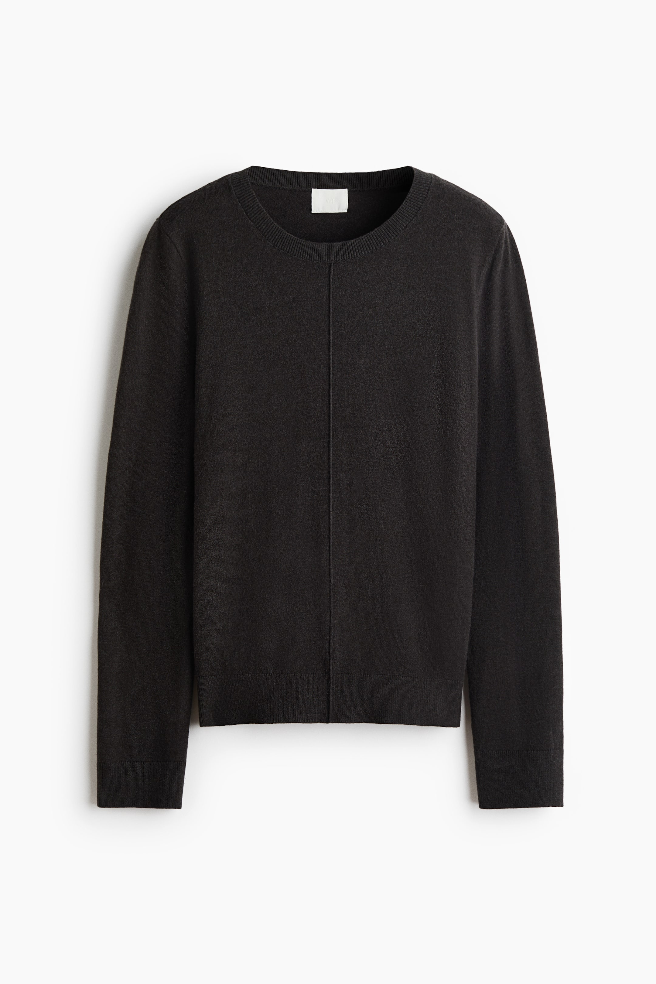 View larger image: A black crew neck sweater is showcasing its front view, highlighting a fine knit texture, a ribbed crew neck, ribbed cuffs, and a ribbed hem, with a vertical seam running down the centre front.
