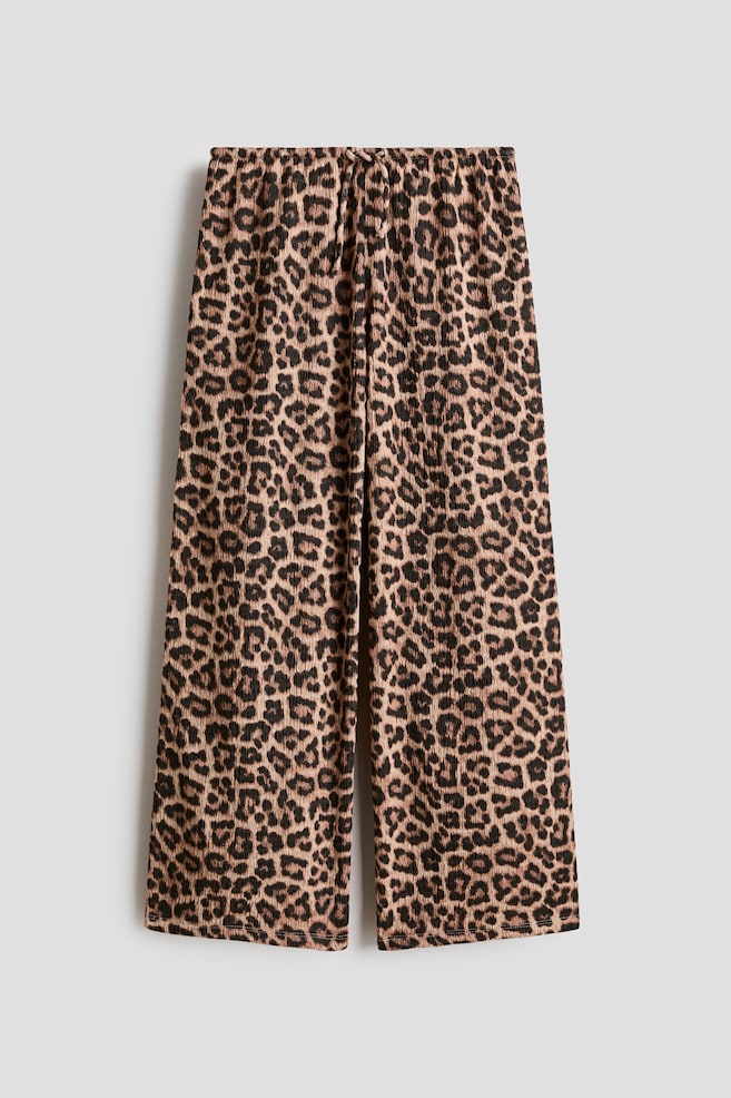 Pantaloni din jerseu texturat - Bej/imprimeu leopard/Negru/Alb/flori/Negru/Roz/Verde-prăfuit deschis/Crem/motive/Maro-închis/Alb/flori albastre - 1