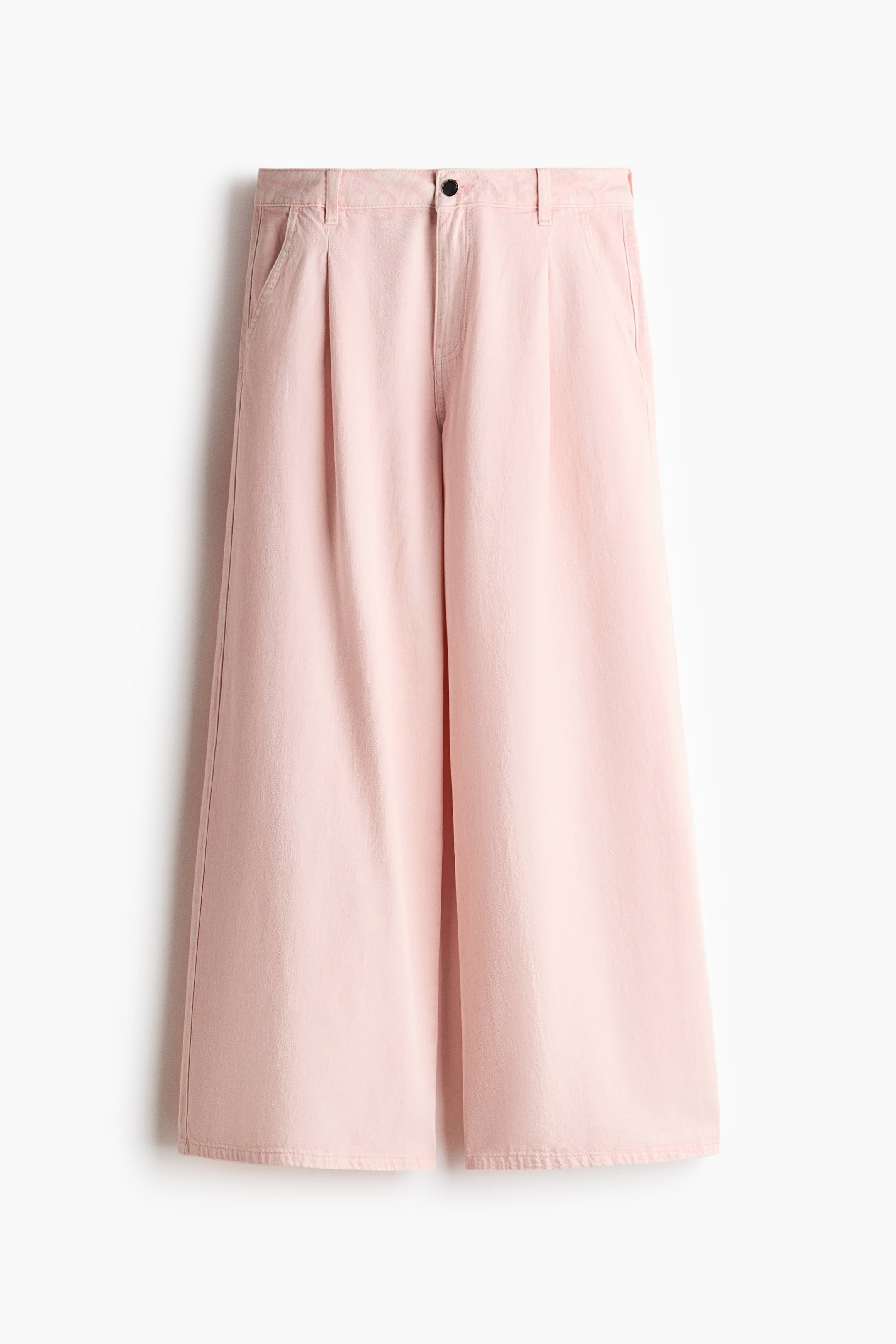 View larger image: Pink loose-fit pants are shown front-facing, featuring a zip fly with a black button closure and belt loops. These lightweight twill pants include diagonal side pockets and wide legs with pleats at the top.