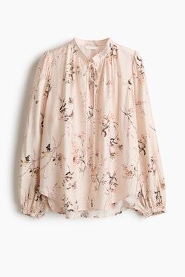 Blus med knytdetalj
