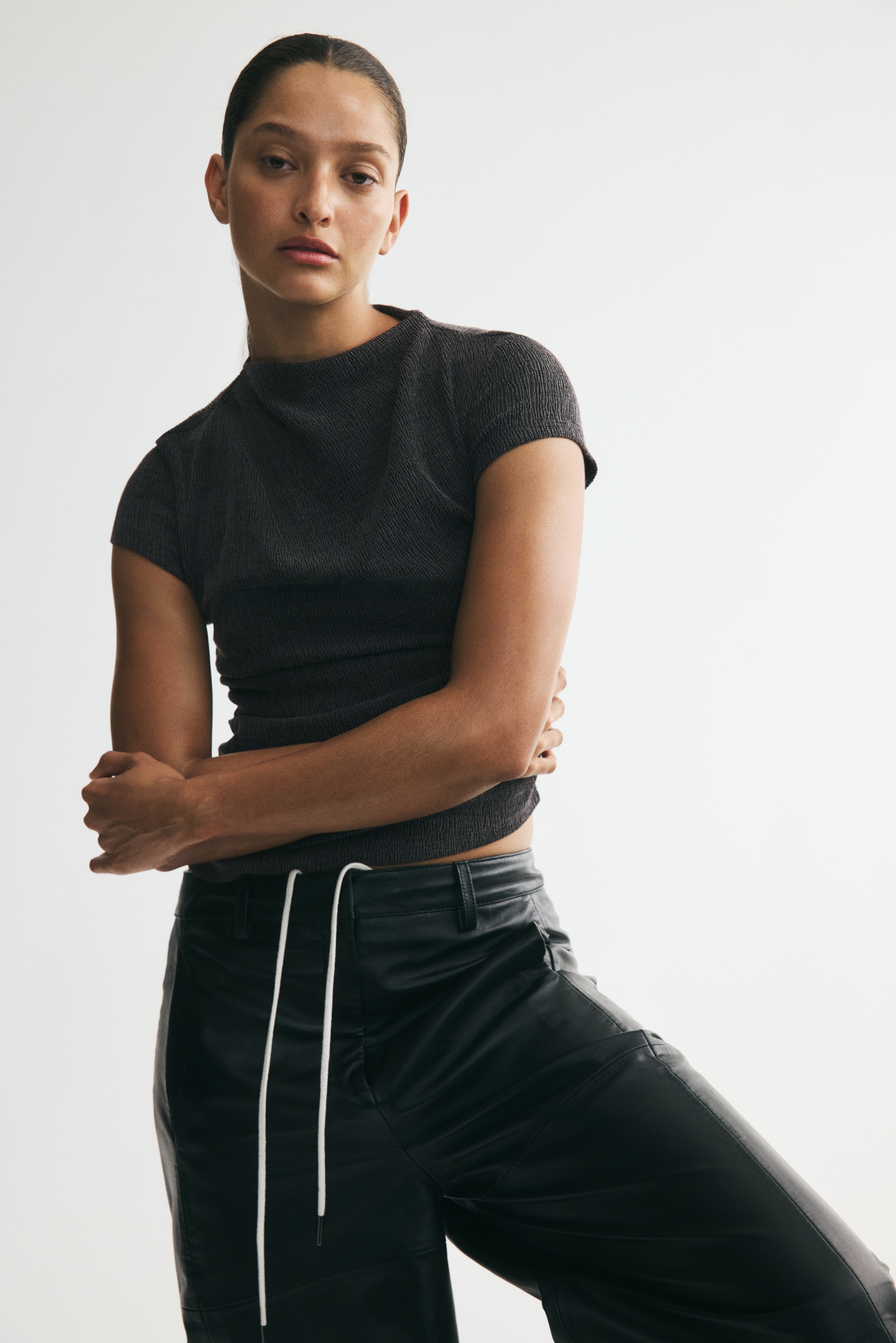 Crinkled asymmetric topModel