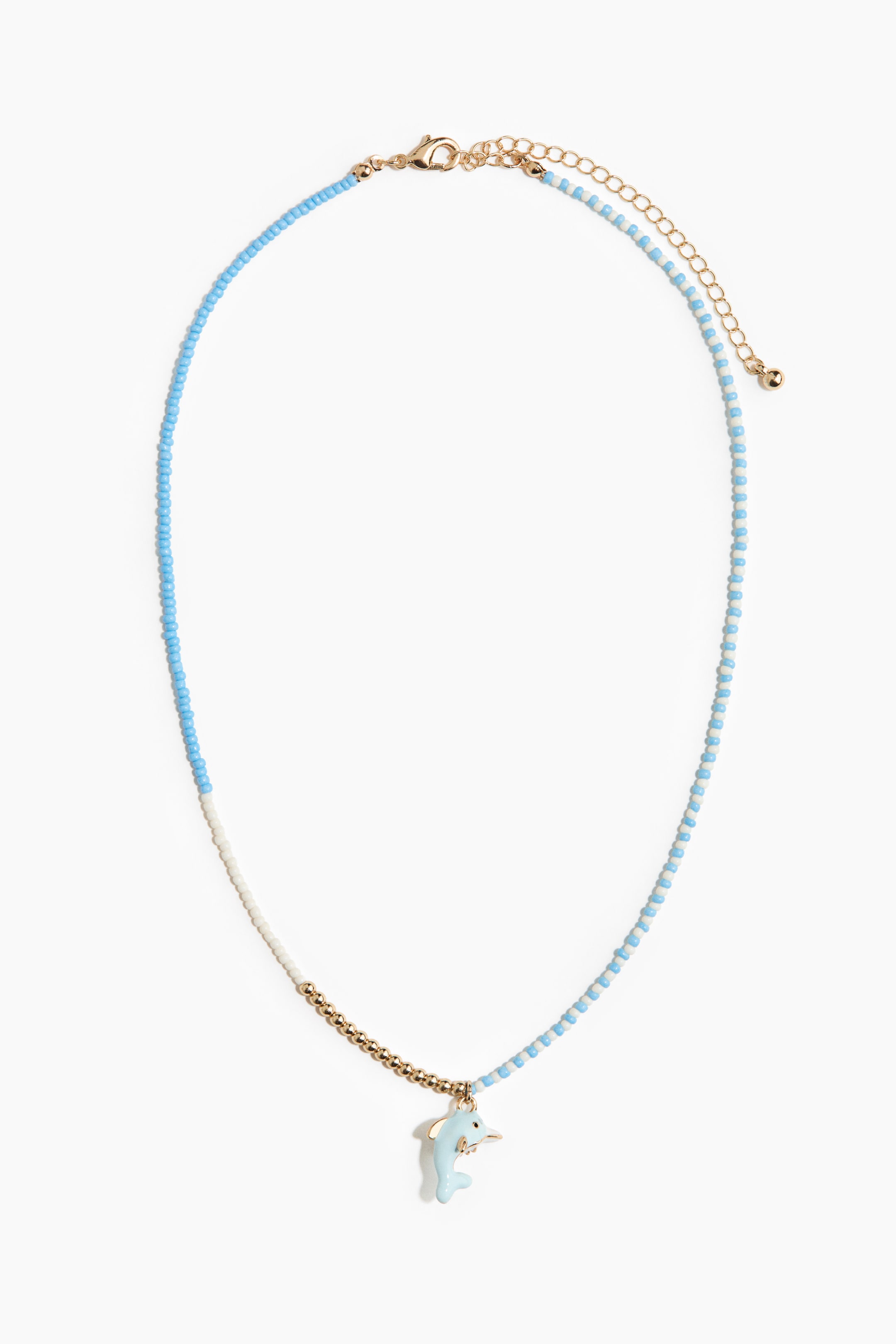 View larger image: This necklace features a beaded chain, with the left side showcasing solid light blue beads, while the right side displays alternating light blue and white beads. These converge at the bottom center with a segment of gold-toned spherical beads, from which a light blue dolphin charm hangs. A gold-toned lobster clasp with an extender chain secures the necklace at the top.