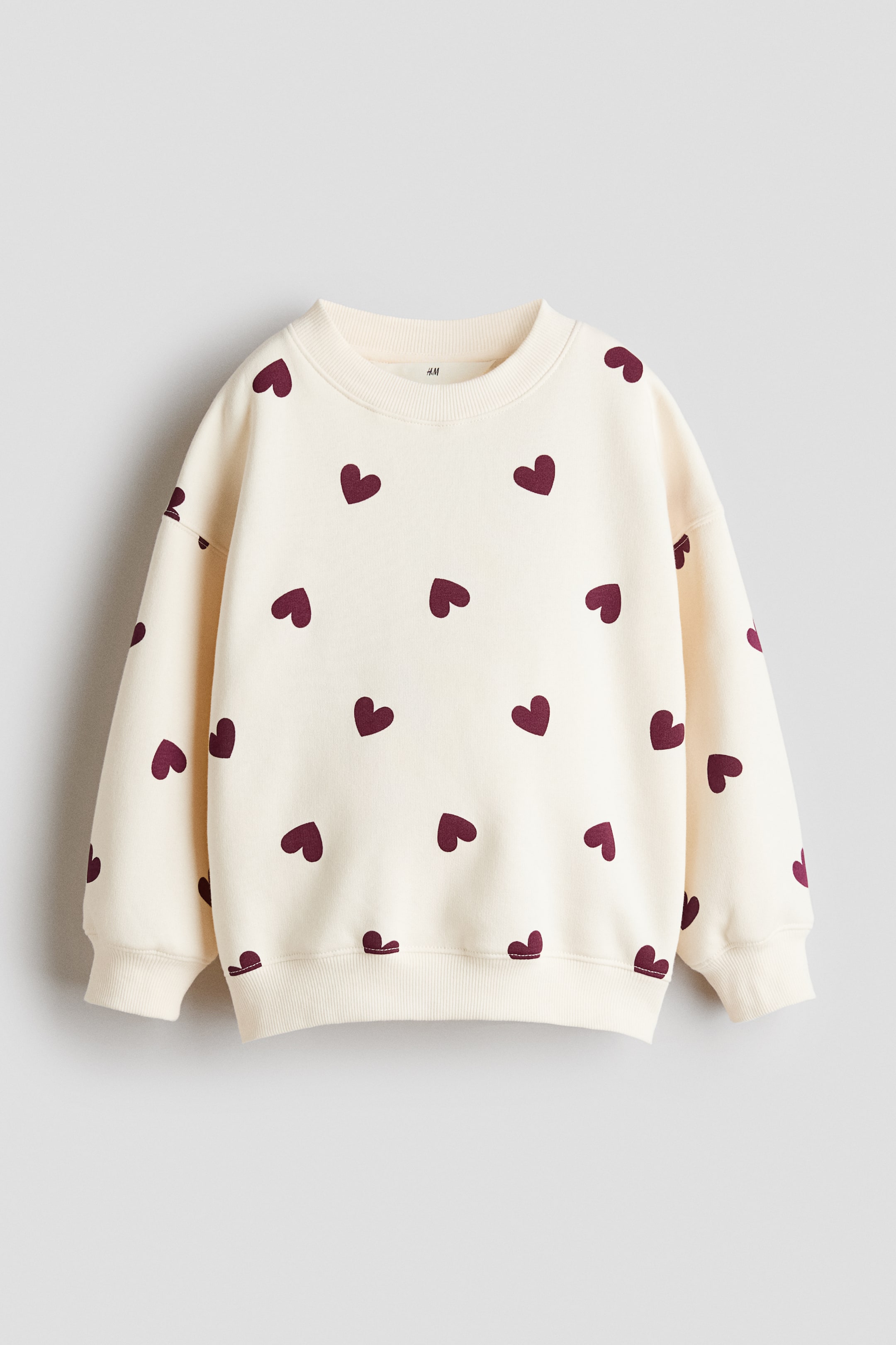 View larger image: Brushed-inside sweatshirt - Cream/Hearts - Kids | H&M 1