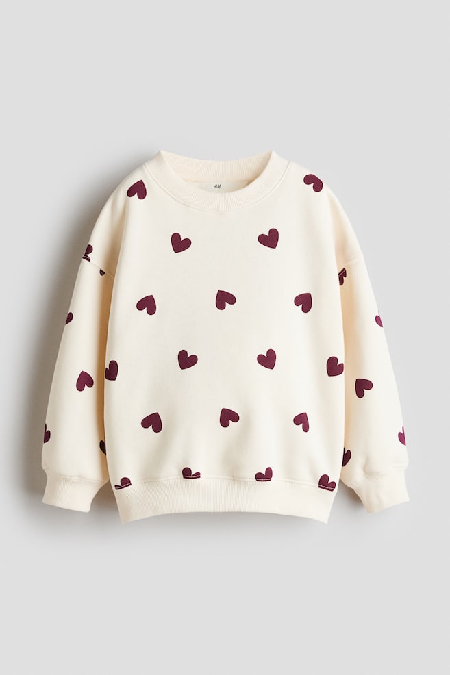 Brushed-inside sweatshirt - Cream/Hearts/Ivory/Hearts/Dusty purple/Hearts/Light blue/Cherries/Light dusty pink/Cherries/Pink/Turquoise/Hearts/Dark grey/Hearts/Light beige/Leopard print/Mole/Hearts/Cream/Hearts/Light pink/Hearts/Dark brown/Polka dot/Dark red/Hearts - 1