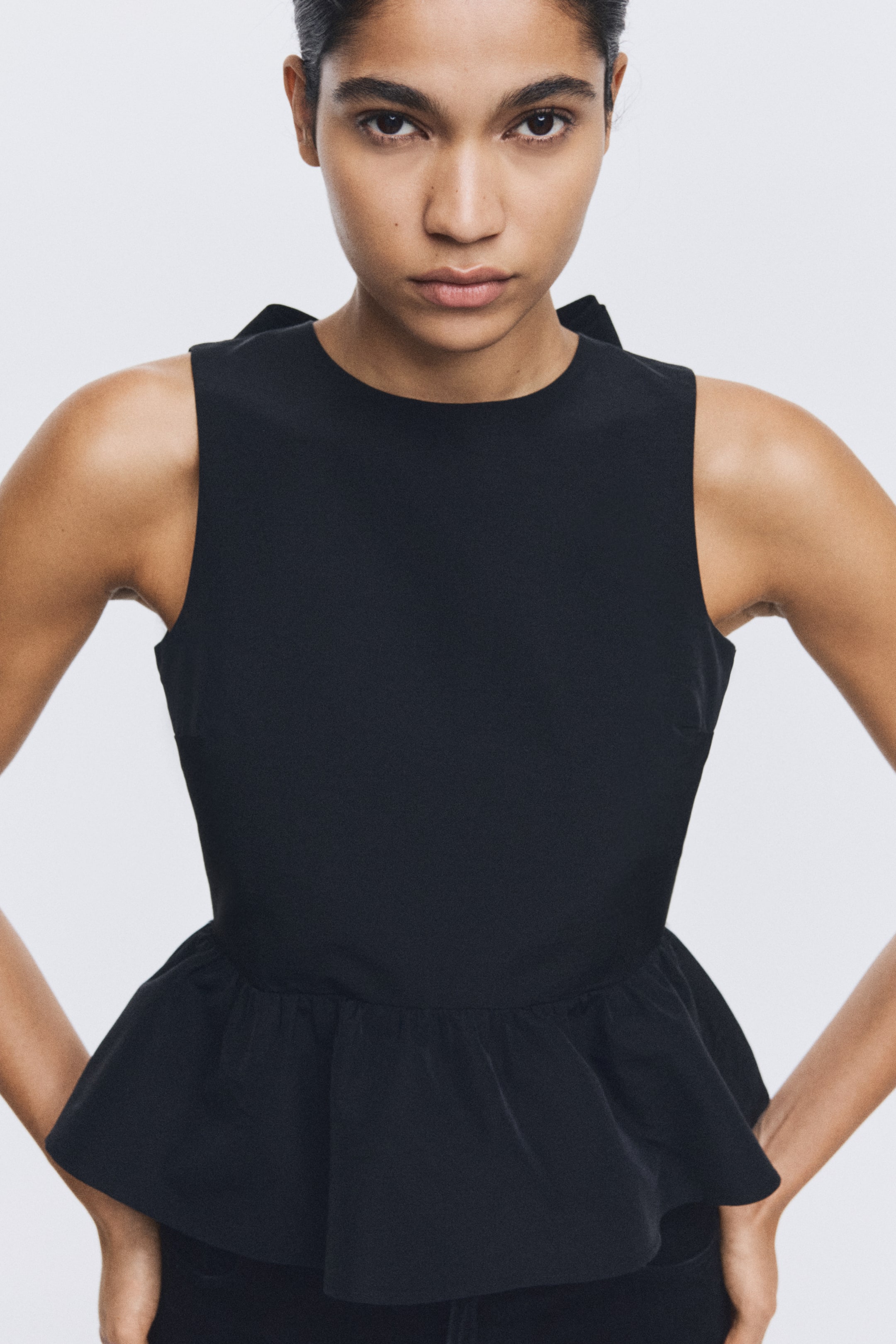 Ver imagen más grande: Top con lazada y peplum - Negro - MUJER | H&M ES 3