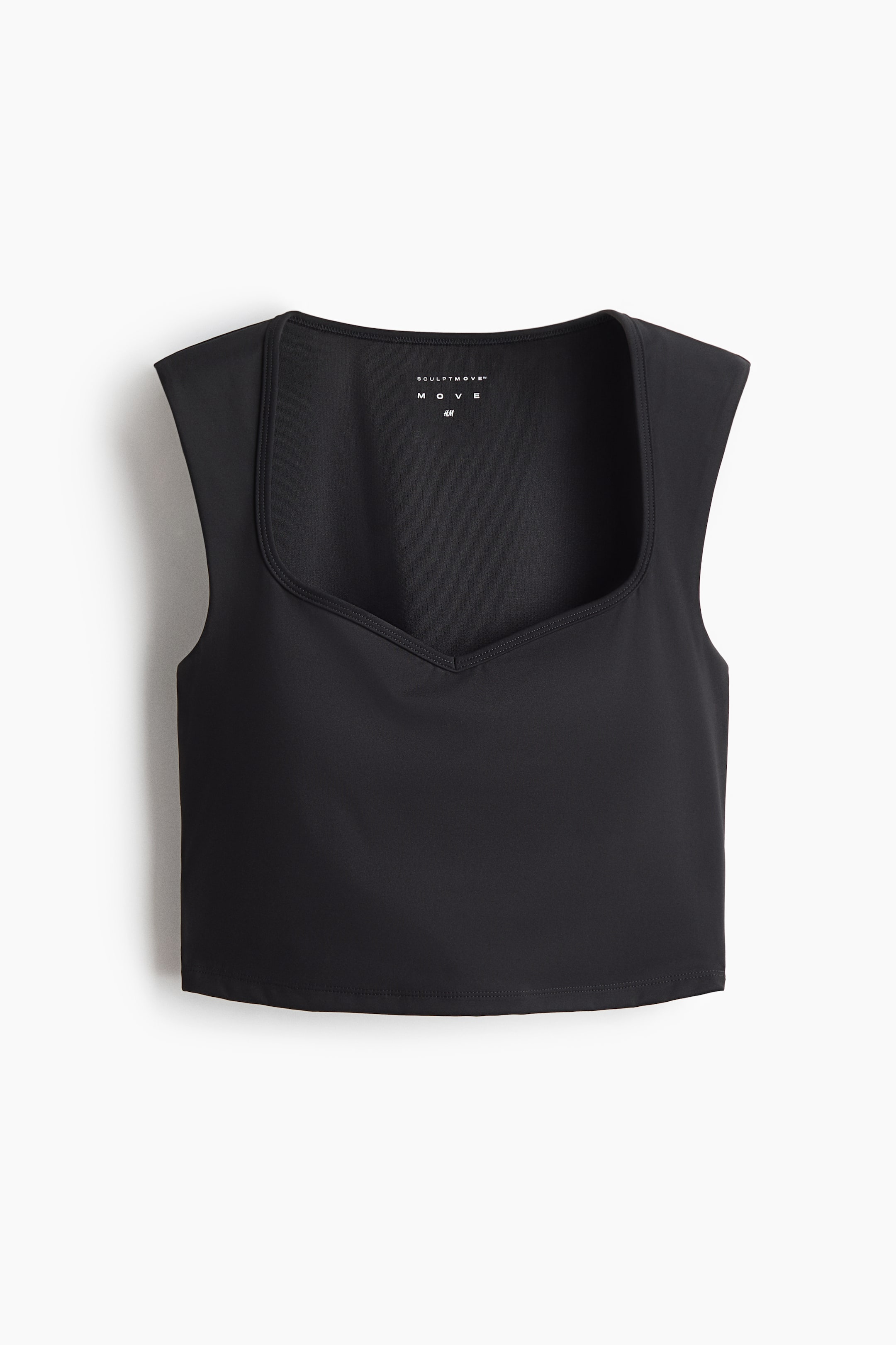 View larger image: A black cropped top features a square neckline with a V-shaped front detail, wide shoulder straps, and a straight hem. A white brand label is visible on the interior back neckline.