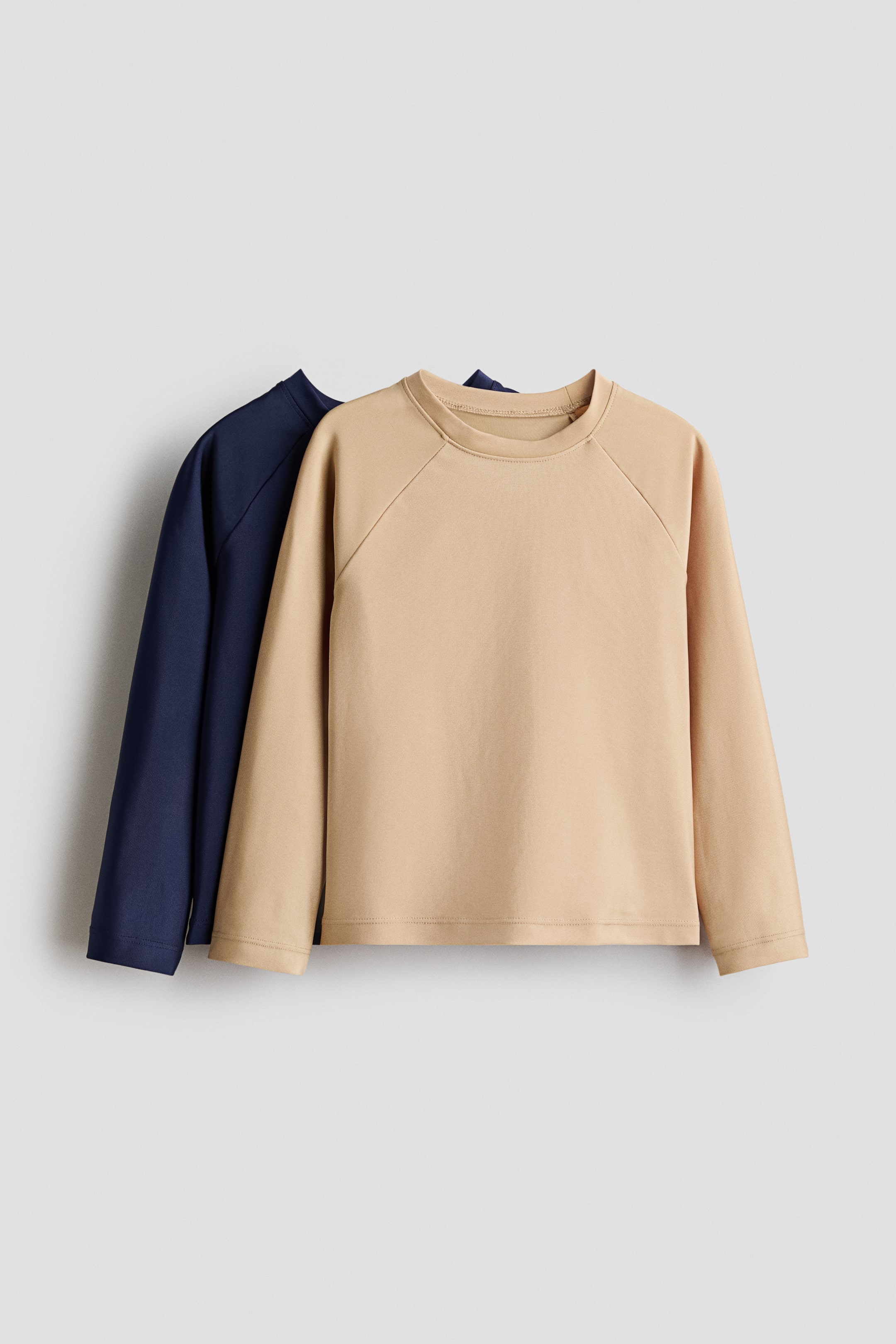 Größeres Bild ansehen: 2er-Pack Badeshirts mit UPF 50 - Beige/Marineblau - Kids | H&M DE 1