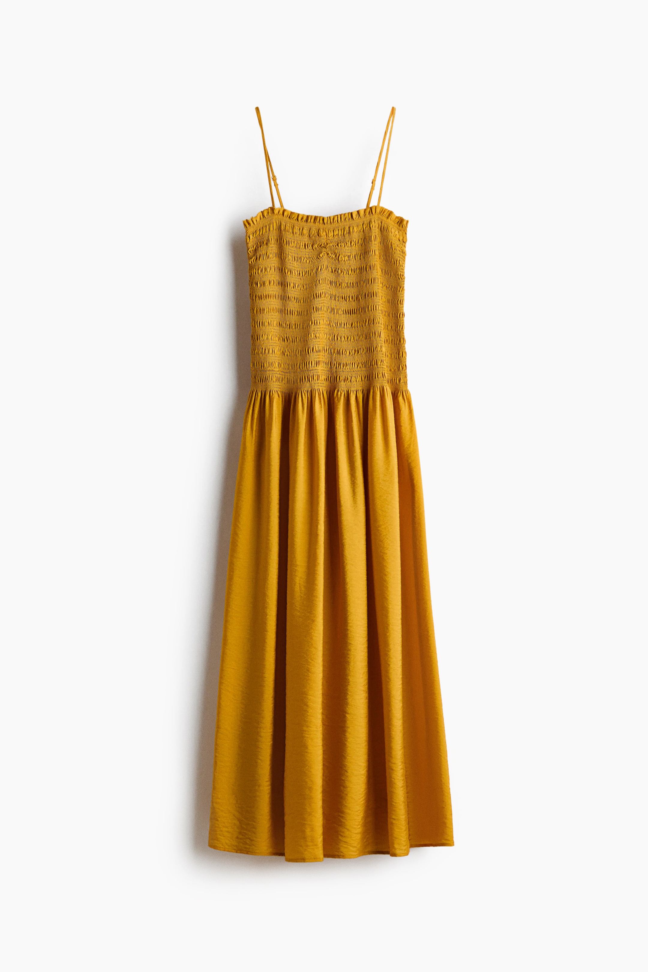 View larger image: A mustard yellow midi dress showcasing a shirred, strapless bodice with slender spaghetti straps, and a flowing, gathered skirt with a subtle crinkled texture.
