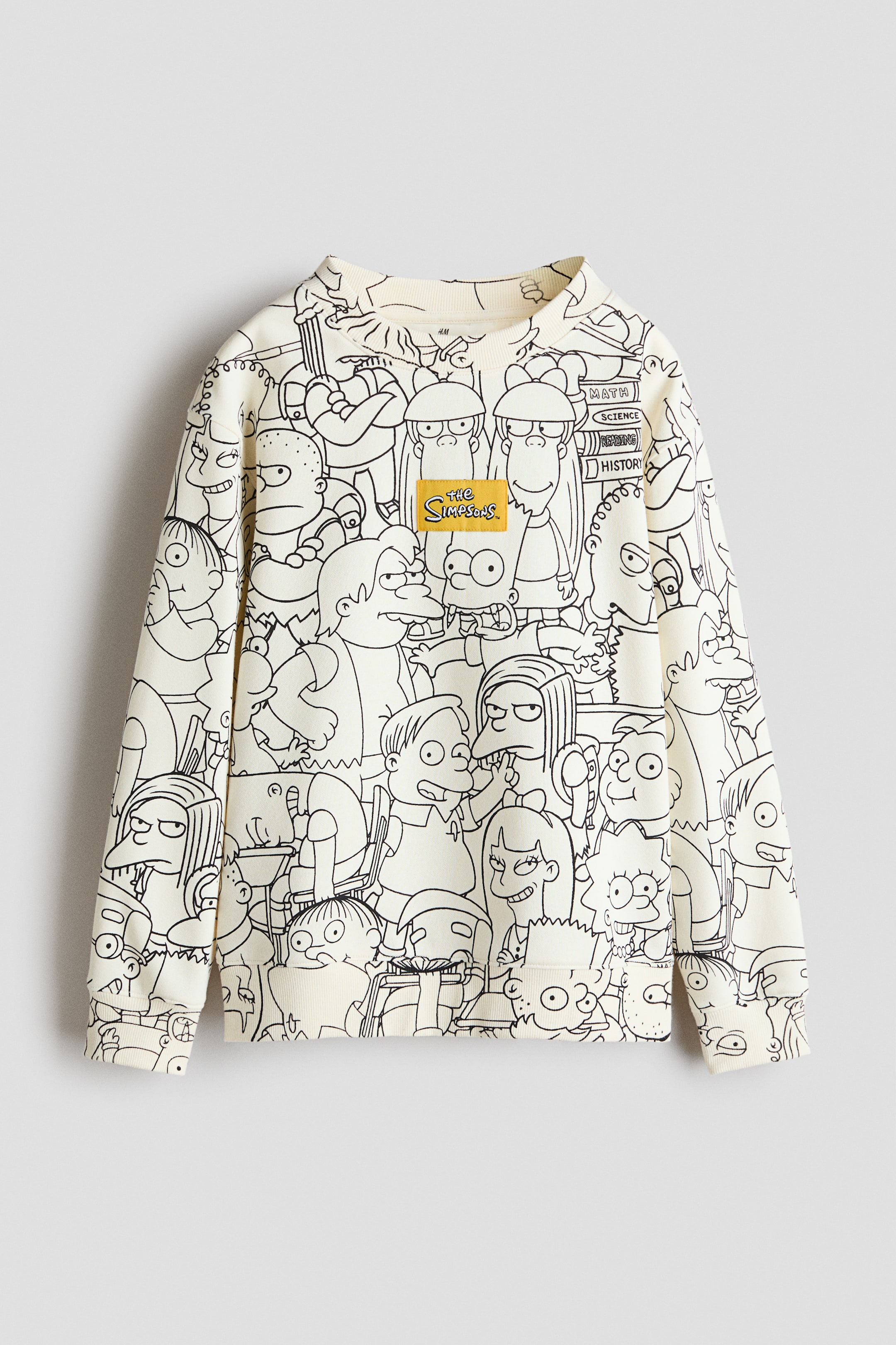 View larger image: A cream-colored sweatshirt showcases a black outline print of numerous "The Simpsons" characters across the entire front. It features a ribbed crewneck, ribbed cuffs, and a ribbed hem with small side slits. A yellow rectangular patch with "The Simpsons" logo is centrally placed on the chest.