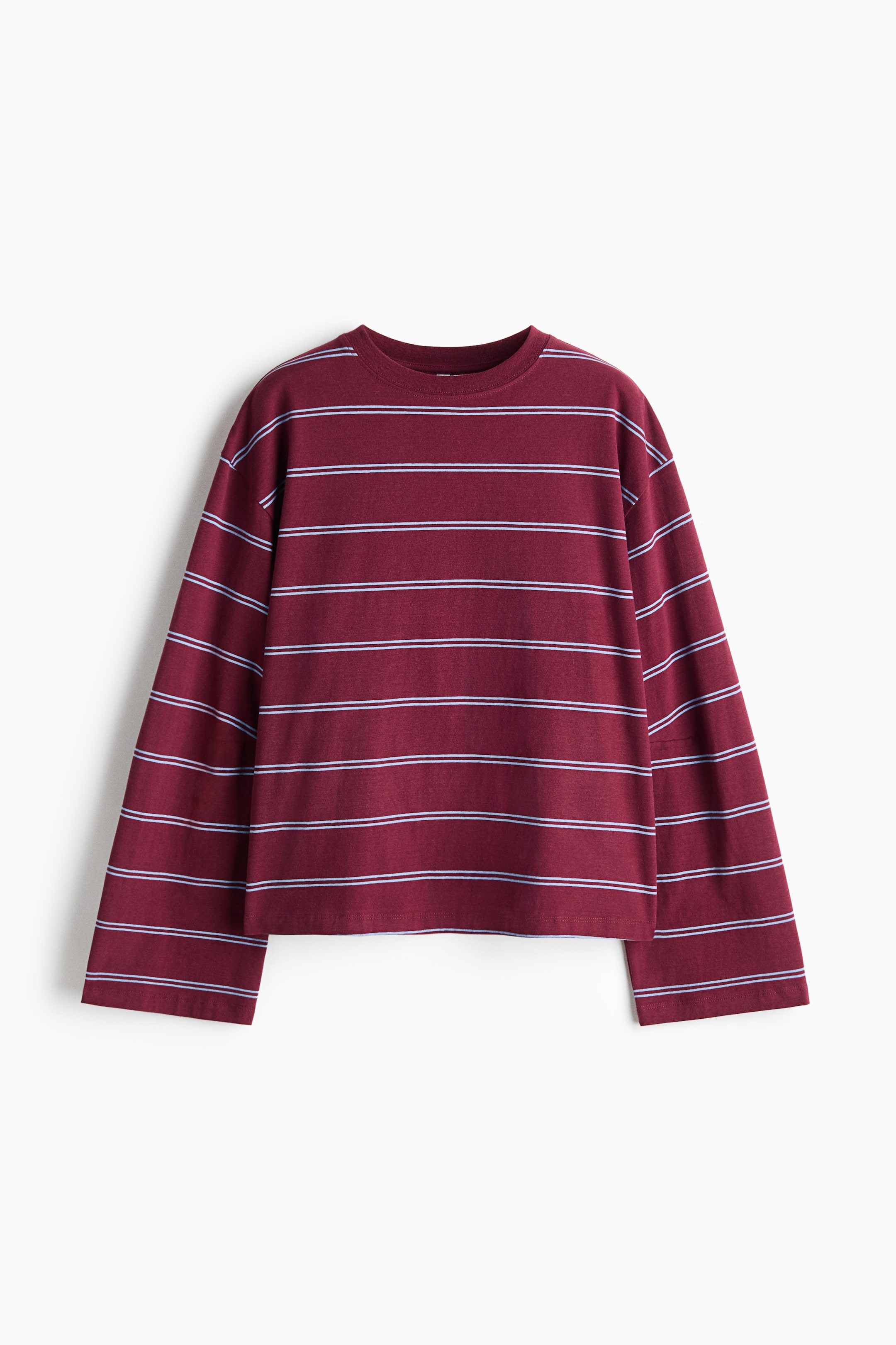 View larger image: A loose-fit, long-sleeved maroon top featuring thin, light-blue horizontal stripes is shown from the front, showcasing a round neckline, dropped shoulders, and wide sleeves with a straight-cut hem.