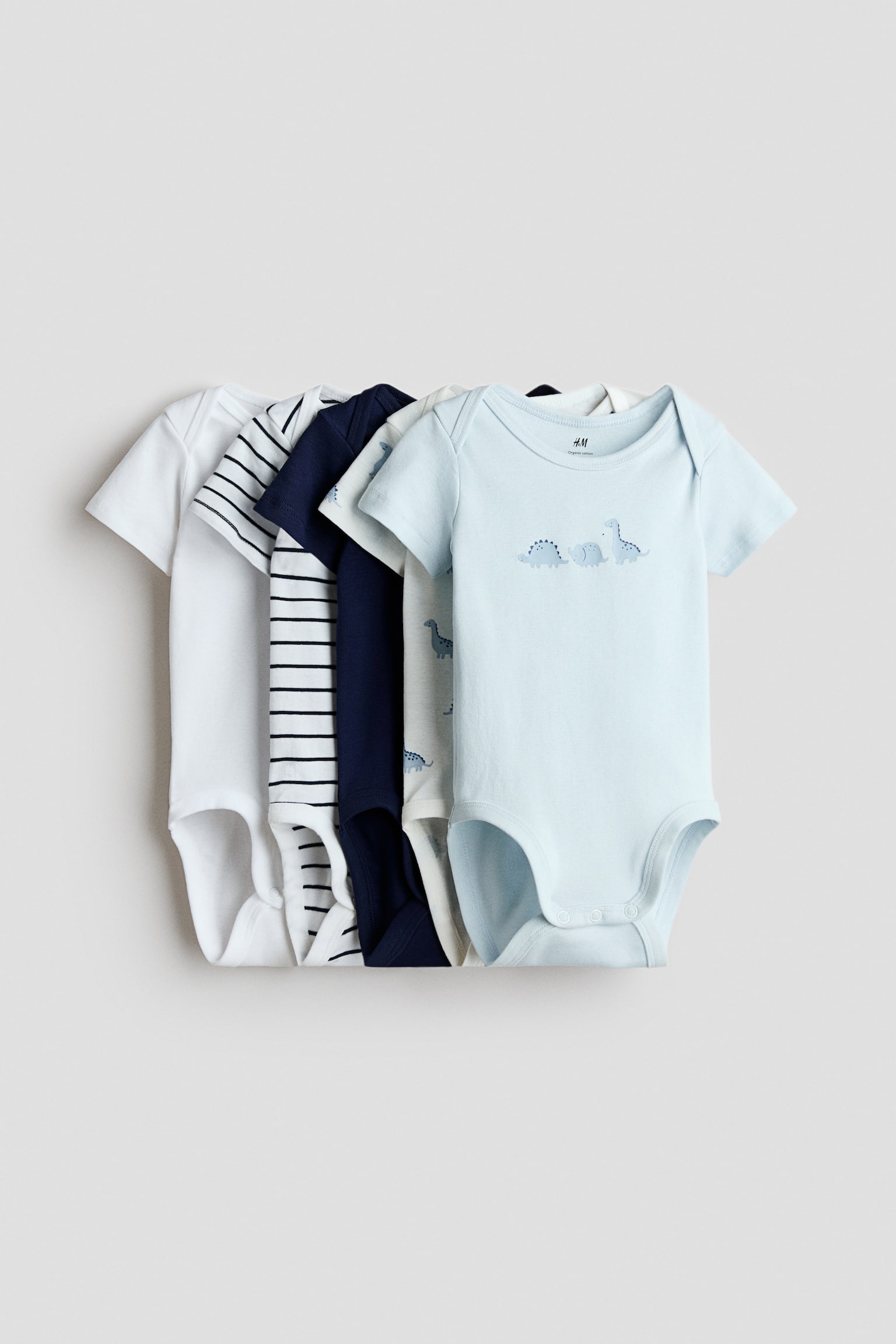 5er-Pack Baumwollbodys - Hellblau/Dinosaurier/Hellbeige/Hunde/Weiss/Tiere/Hellblau/Dinosaurier/Rosa/Herzen/Rosa/Beeren/Blau/Anker/Grau/Gestreift/Hellgrün/Früchte/Hellblau/Blumen/Beige/Häschen/Rosa/Herzen
