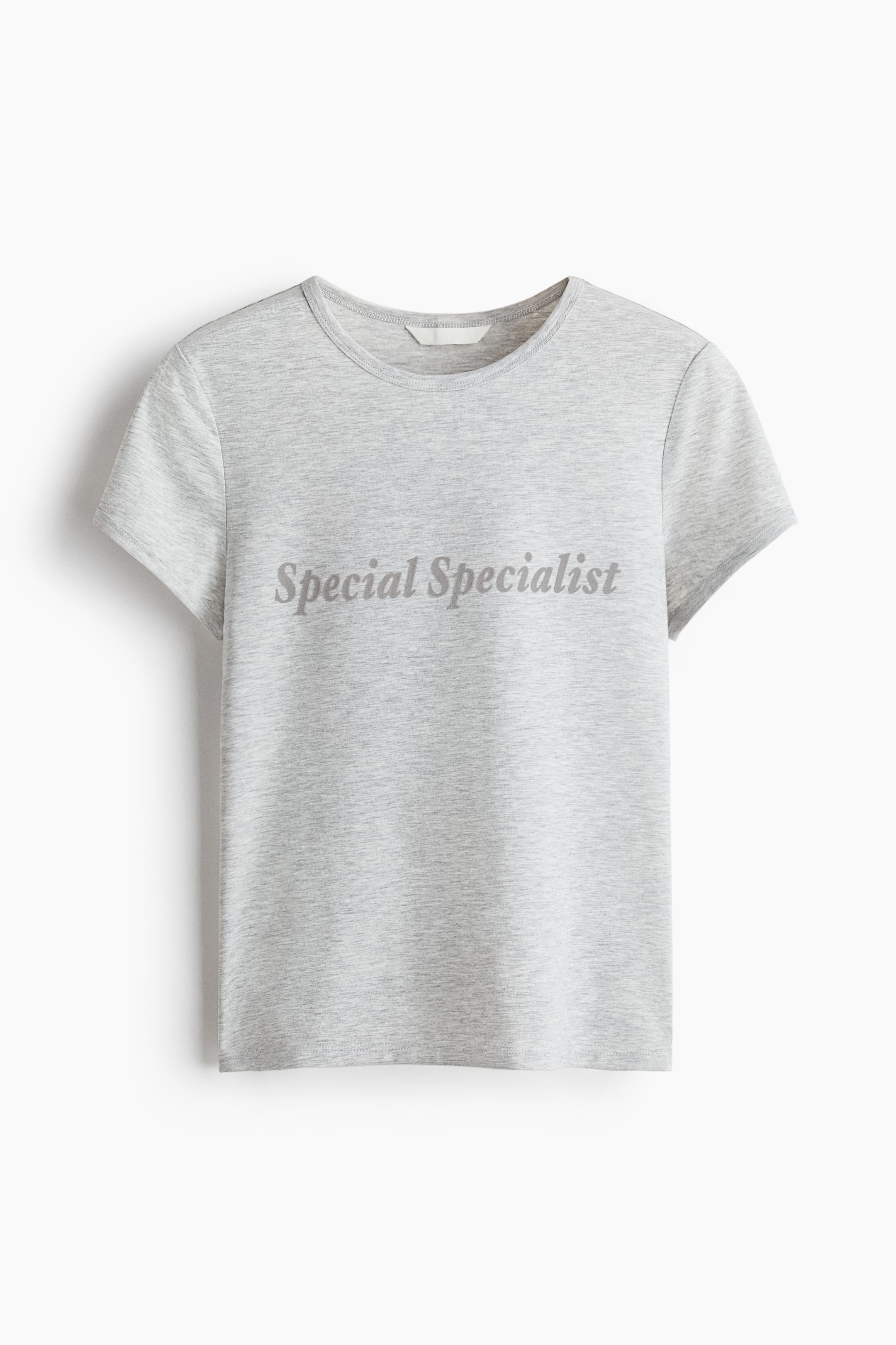 View larger image: A fitted grey jersey t-shirt ditampilkan dari depan, menampilkan leher bulat, lengan pendek, dan potongan hem lurus. Bahagian dada memaparkan "Special Specialist" dicetak dalam teks kelabu gelap yang dicondongkan.