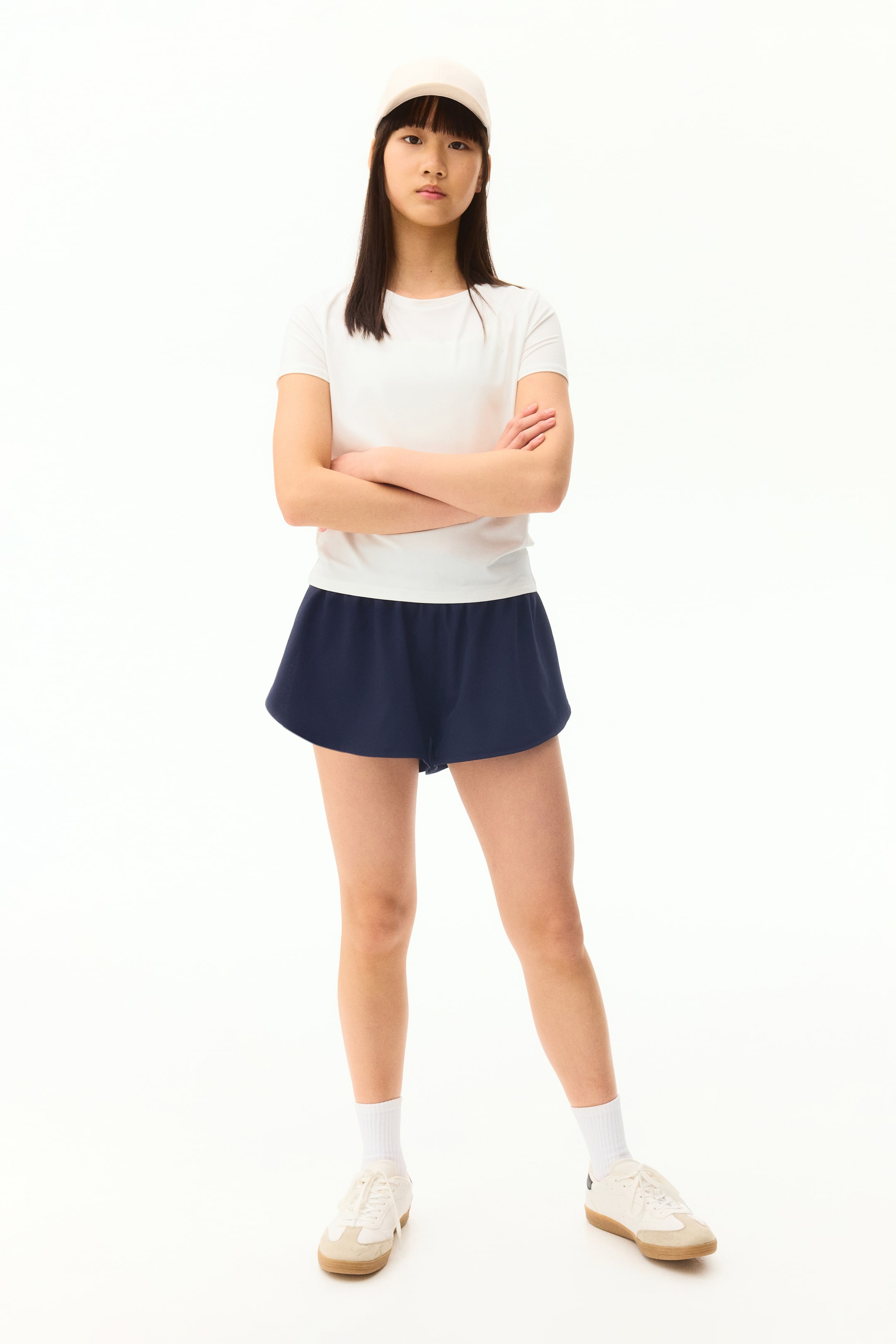View larger image: A plain white short-sleeve t-shirt featuring a crew neck and a regular fit.