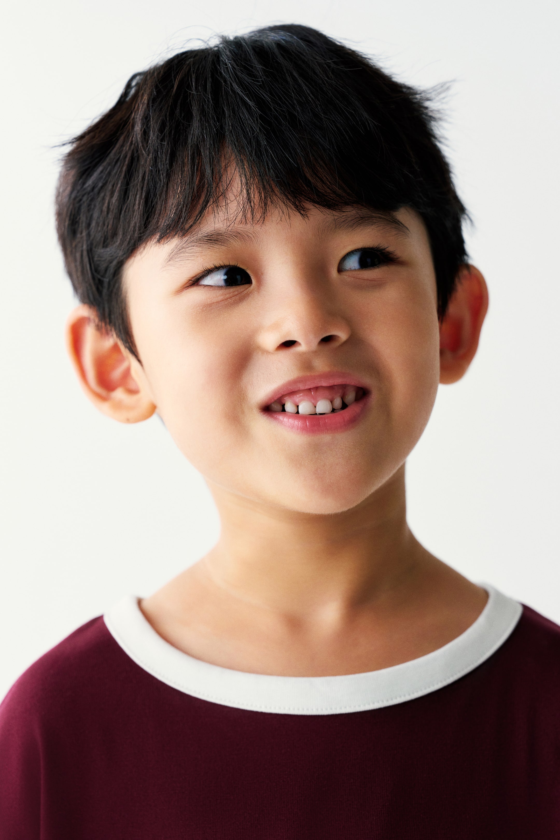 View larger image: The model is wearing a maroon ringer-style T-shirt with a contrasting white crew neck collar.
