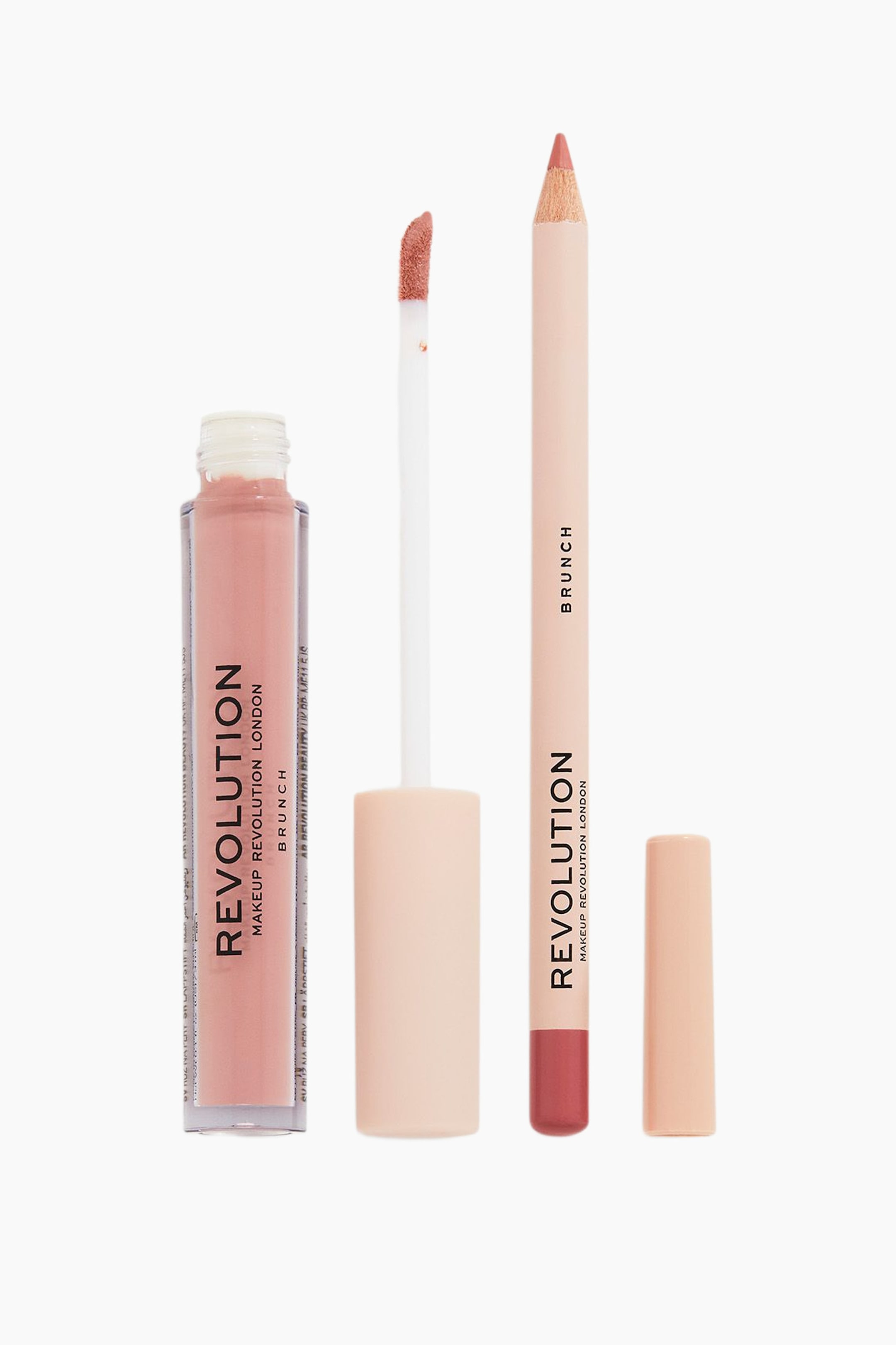 Visa större bild: Ett Revolution lip kit i nyansen "Brunch" visar ett genomskinligt rör med dammrosa flytande läppstift bredvid en avskruvad doe-foot-applikator med ett ljust persikorosa skaft. Intill dem står vertikalt en vässad läppenna med en matchande ljus persikorosa träkropp, en mauve-rosa spets och dess avtagna kork.