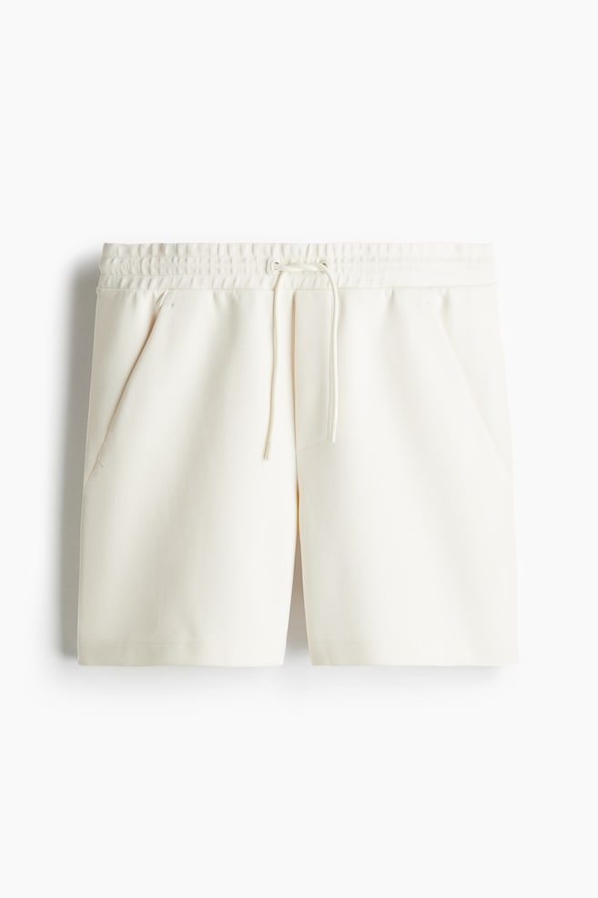 Pantalón corto en sudadera Regular Fit - Crema/Negro/Verde pálido/Gris claro - 1