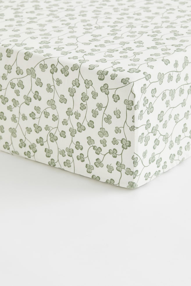 Patterned Cotton Fitted Sheet - Green/clover/White/cherries/Pink/floral/Light beige/dinosaurs/Light green/vehicles/Light pink/floral/Light taupe/floral/Light beige/unicorns/Light blue/fish/White/dotted/Light yellow/oranges - 1