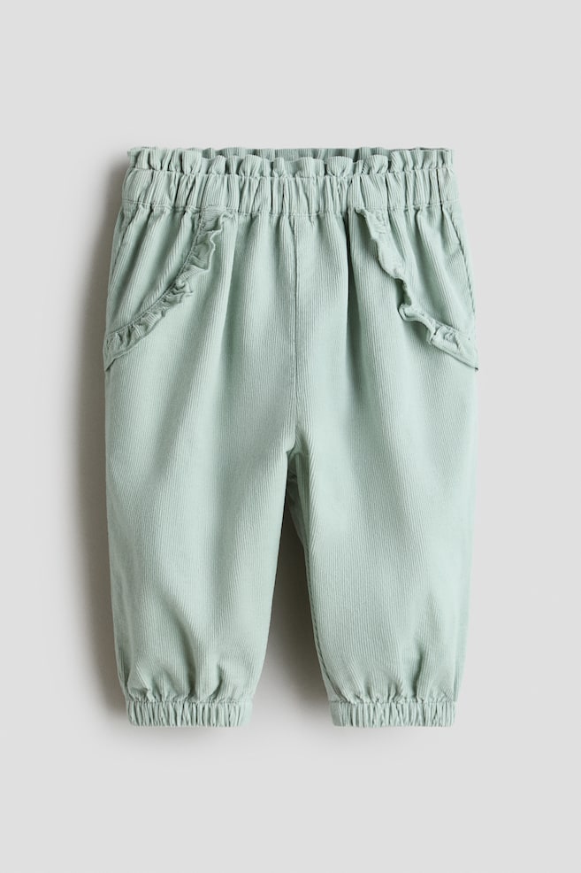 Ruffle-Trimmed Corduroy Pants - Light dusty green/Light pink - 1