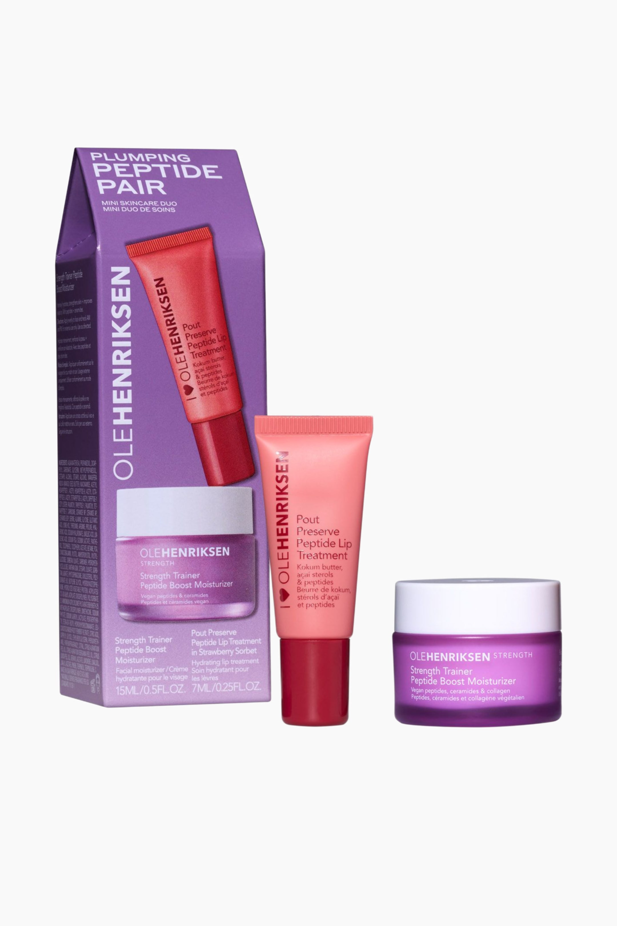 Se større billede: Et Ole Henriksen Plumping Peptide Pair mini hudplejesæt er udstillet og indeholder en lilla æske med en rød læbeplejetube og en lilla fugtighedscreme-krukke. En laksefarvet læbeplejetube med rødt låg og en lilla fugtighedscreme-krukke med hvidt låg står oprejst ved siden af æsken.