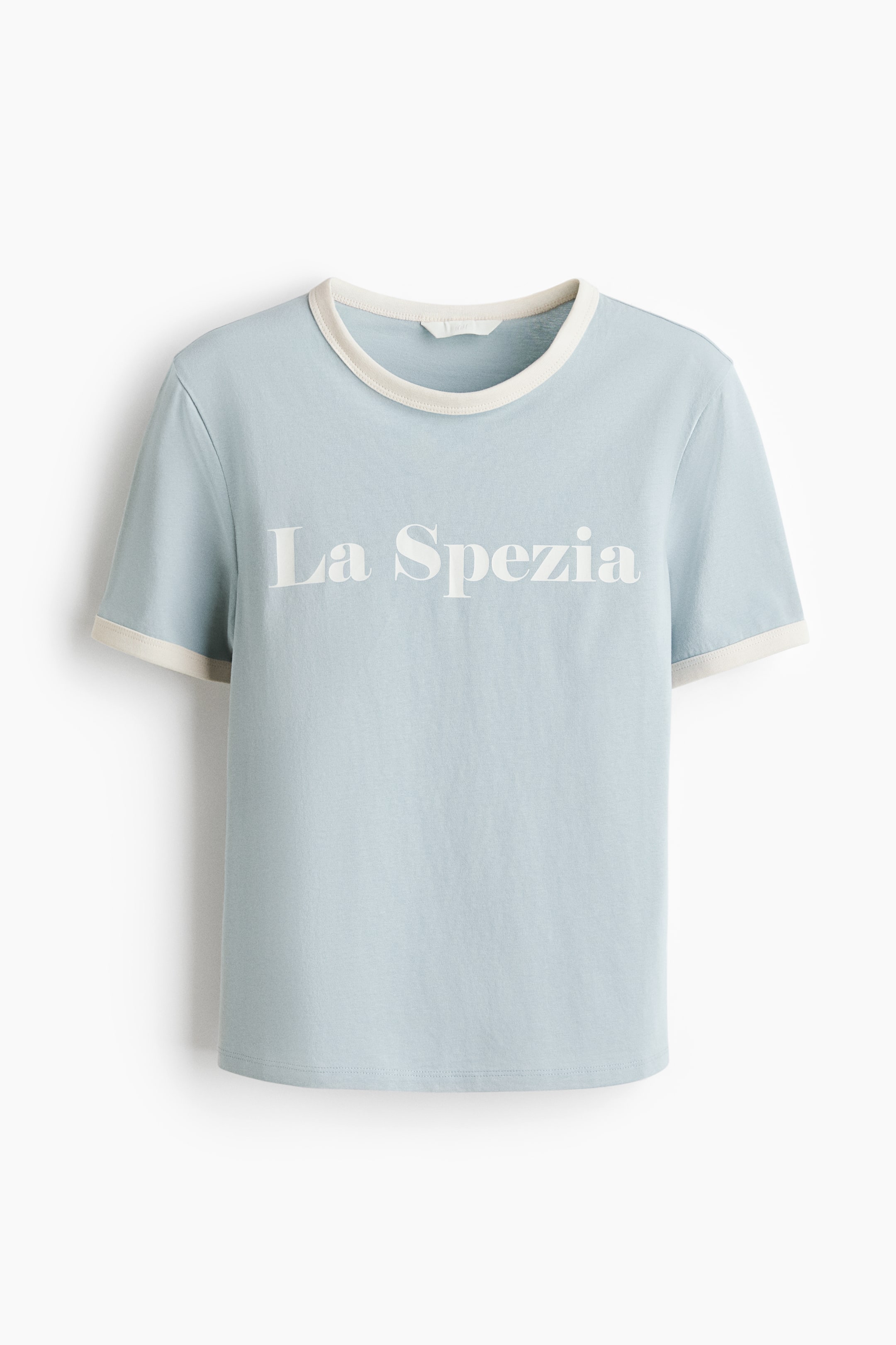 View larger image: The light blue t-shirt showcases its front view, highlighting a round neckline and short sleeves, both accented with a contrasting cream band. It displays "La Spezia" in white capital letters across the chest.