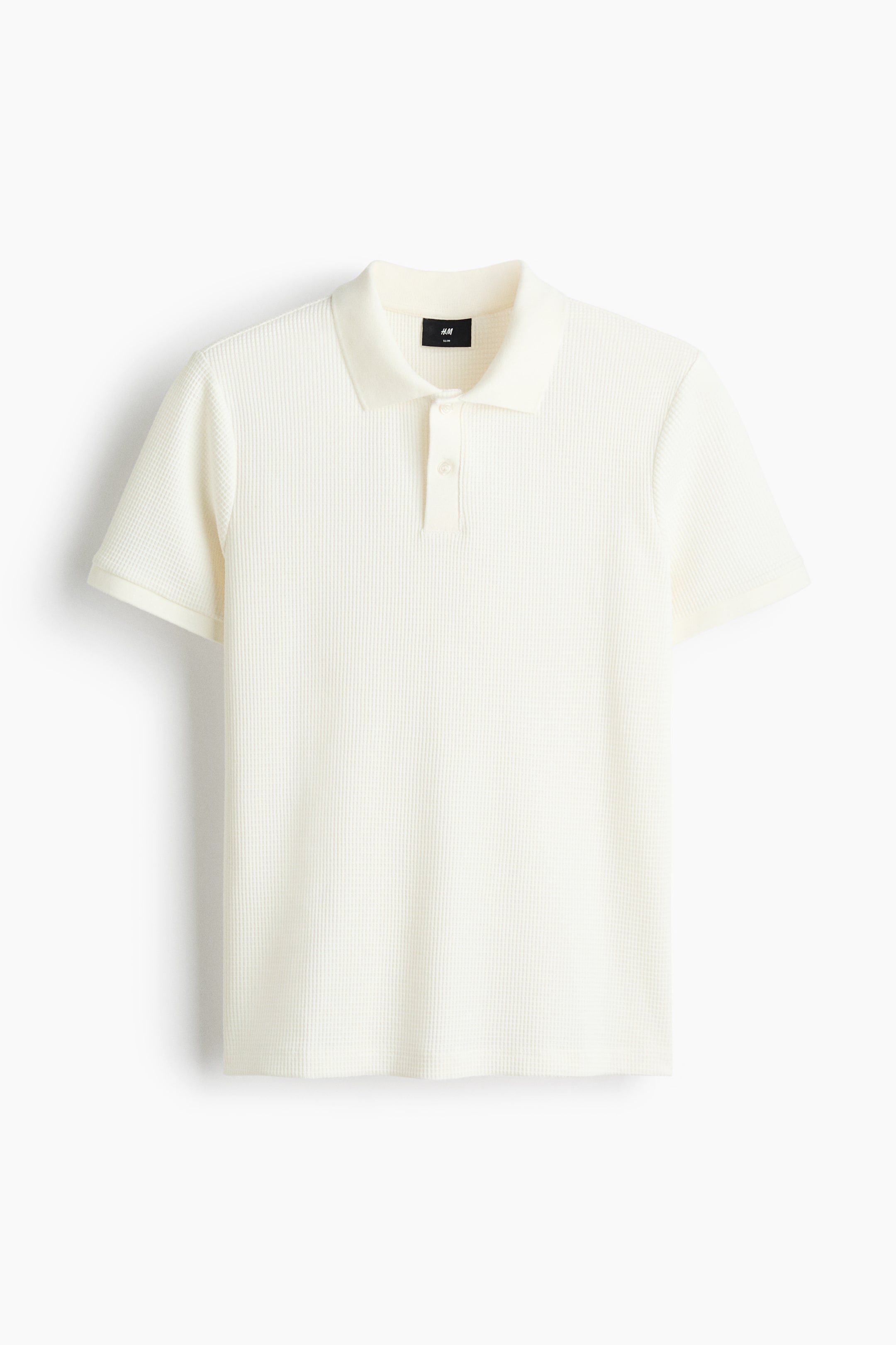 View larger image: An off-white polo shirt is displaying its front, featuring a vertically ribbed knit texture. It is designed with a classic collar, a two-button placket, and short sleeves with plain cuffs.