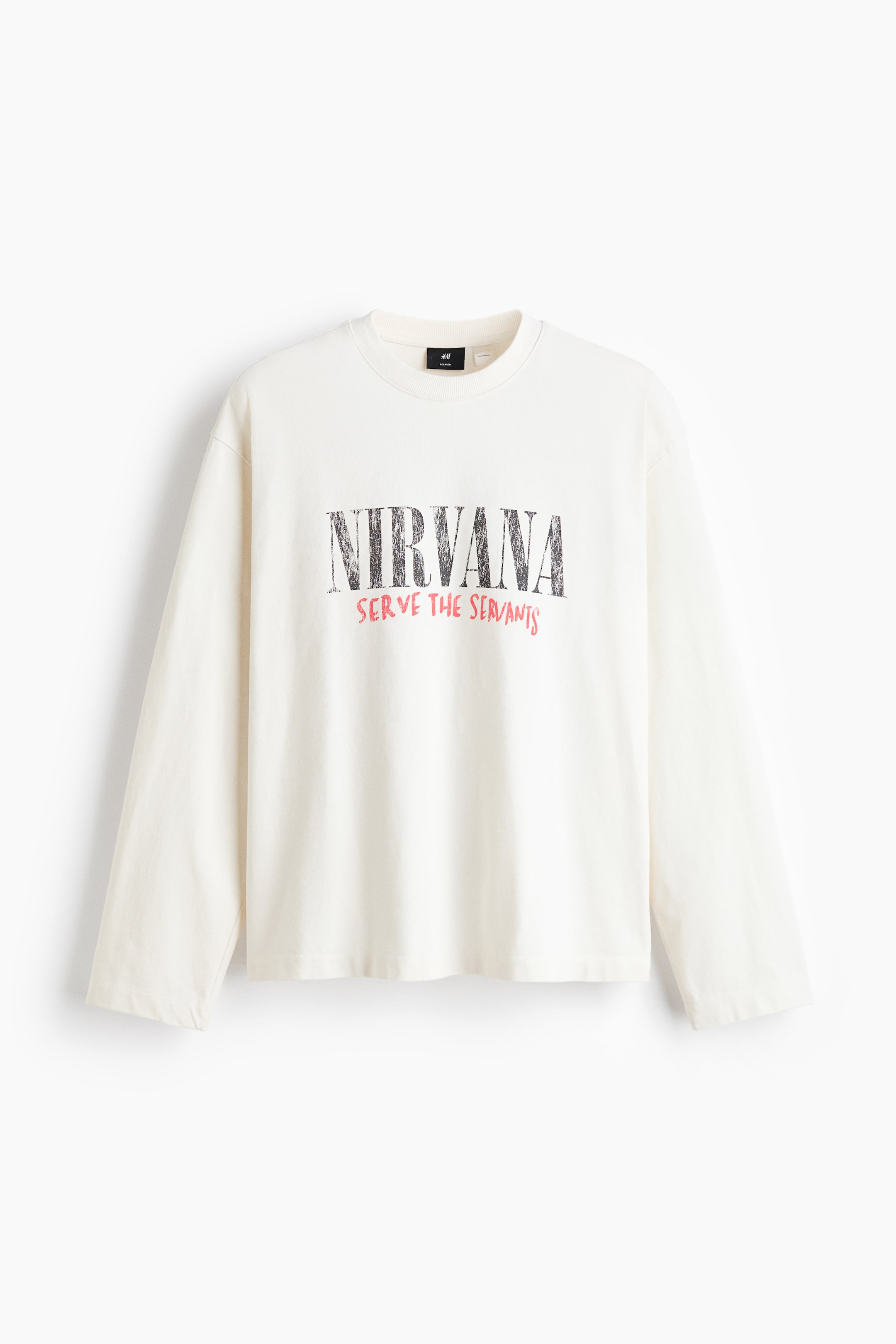 View larger image: A cream long-sleeved top showcasing a ribbed crew neck, plain cuffs, and a straight hem. A distressed black "NIRVANA" graphic with "SERVE THE SERVANTS" in red text is displayed on the front.