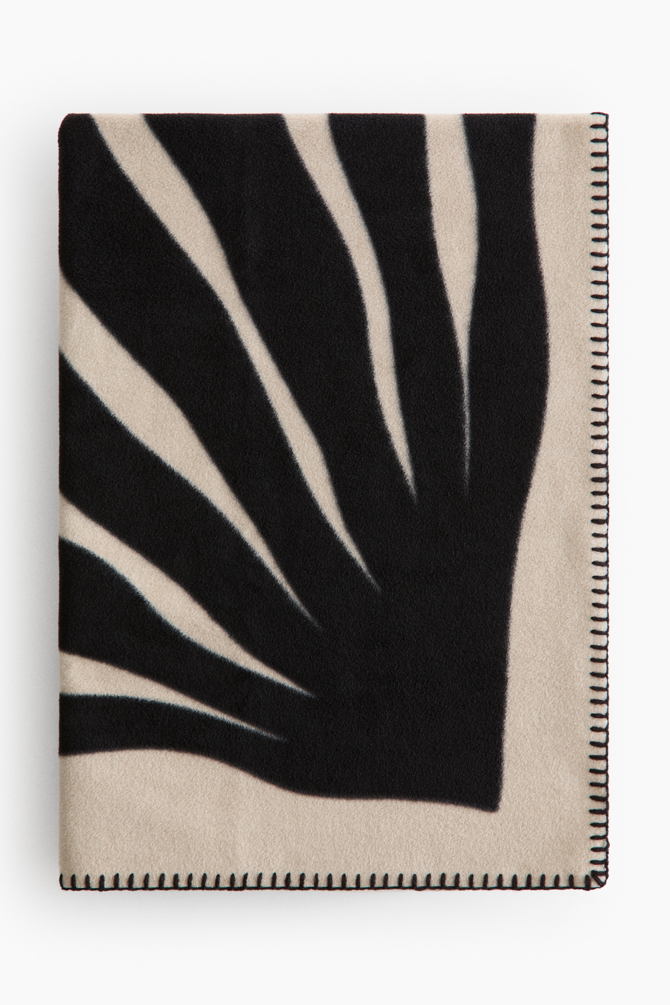 Patterned fleece blanketModel