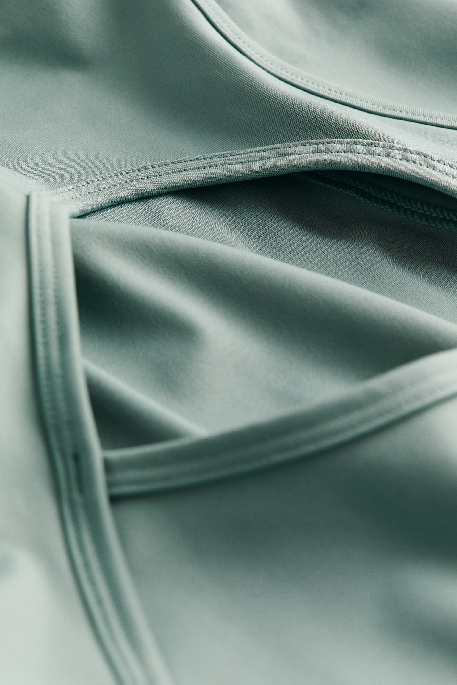 Open-back sports top in DryMove™ - Light teal/Black - 2