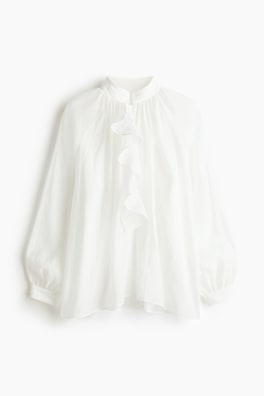 Blus i lyocellmix med volang