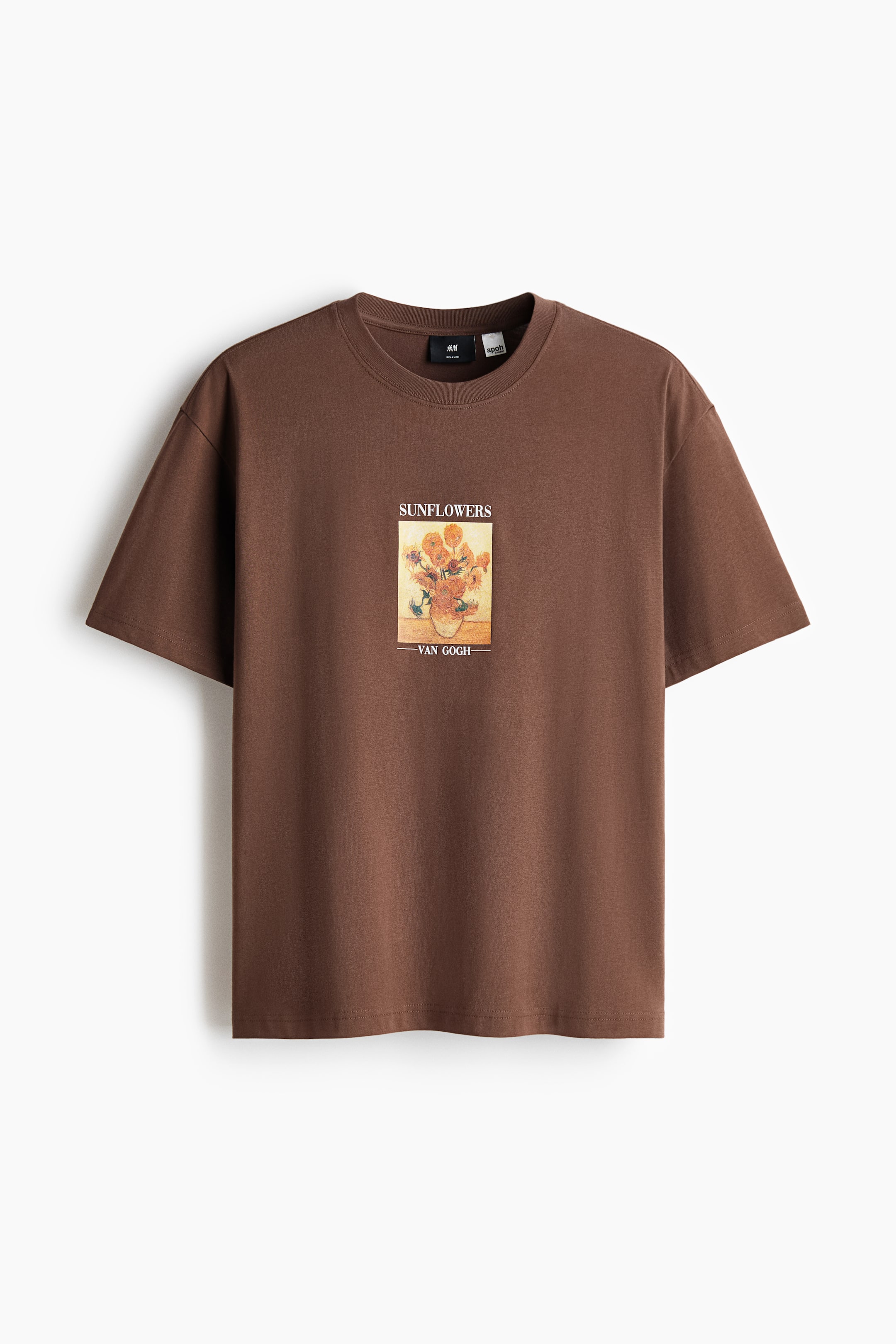 View larger image: A brown, soft mid-weight cotton jersey T-shirt shown front-facing, displaying a central rectangular print of Van Gogh's 'Sunflowers' with 'SUNFLOWERS' above and '- VAN GOGH -' below. It also features a round neckline with a narrow trim, dropped shoulders and short sleeves, offering a loose fit.