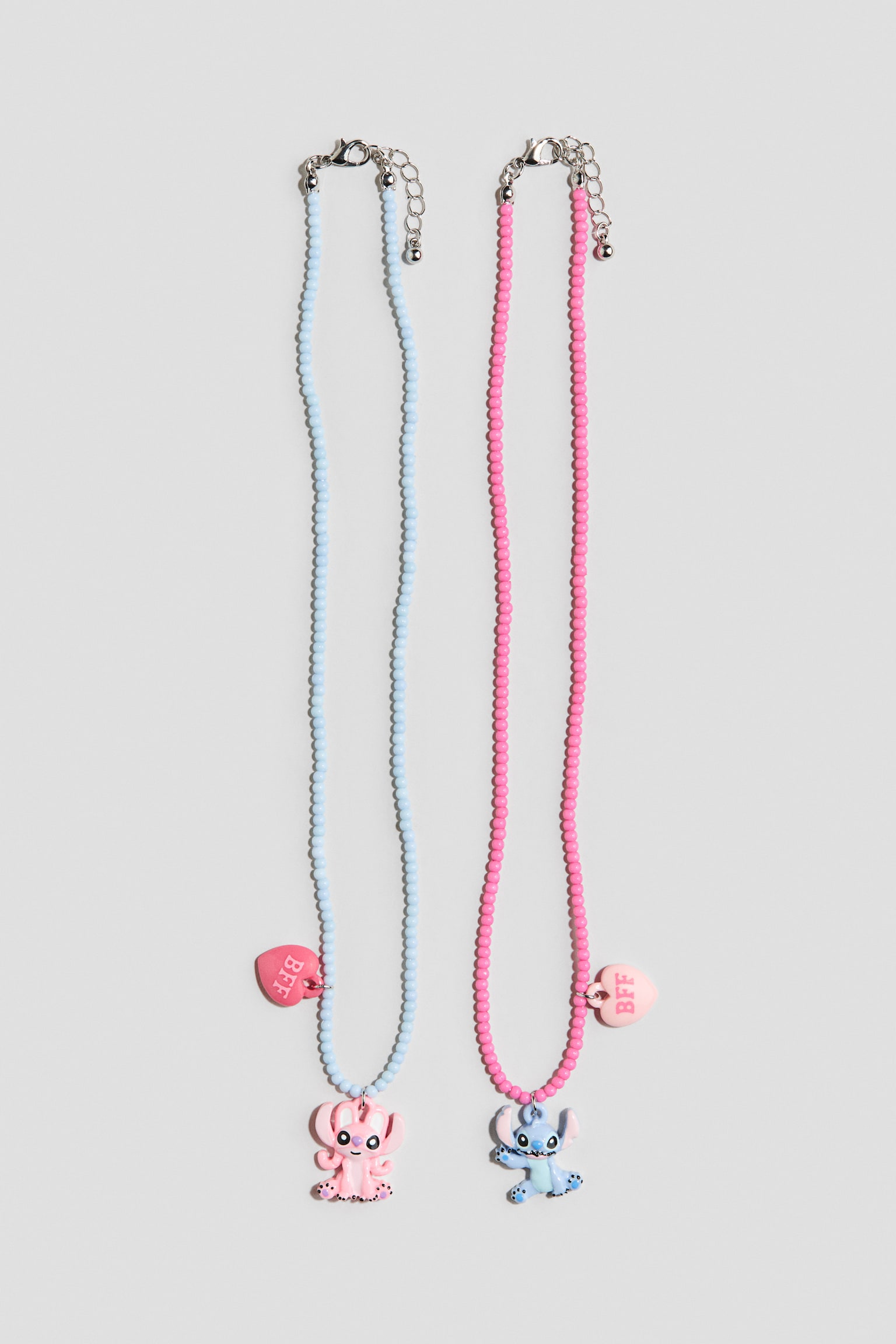 Lot de 2 colliers perles de fantaisie et breloques - Rose/Lilo et Stitch