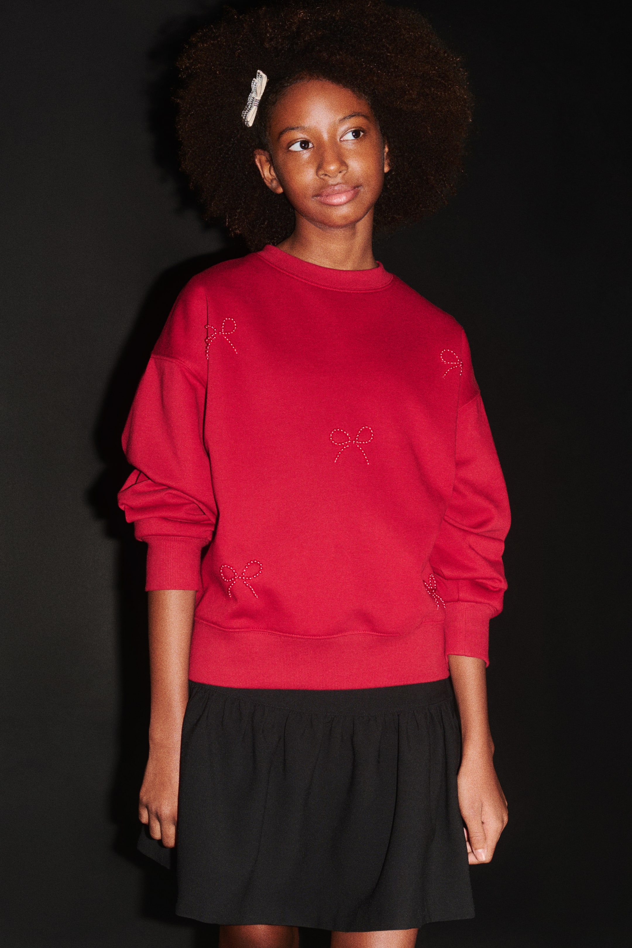 View larger image: Brushed-inside sweatshirt - Red/Bows - Kids | H&M 1