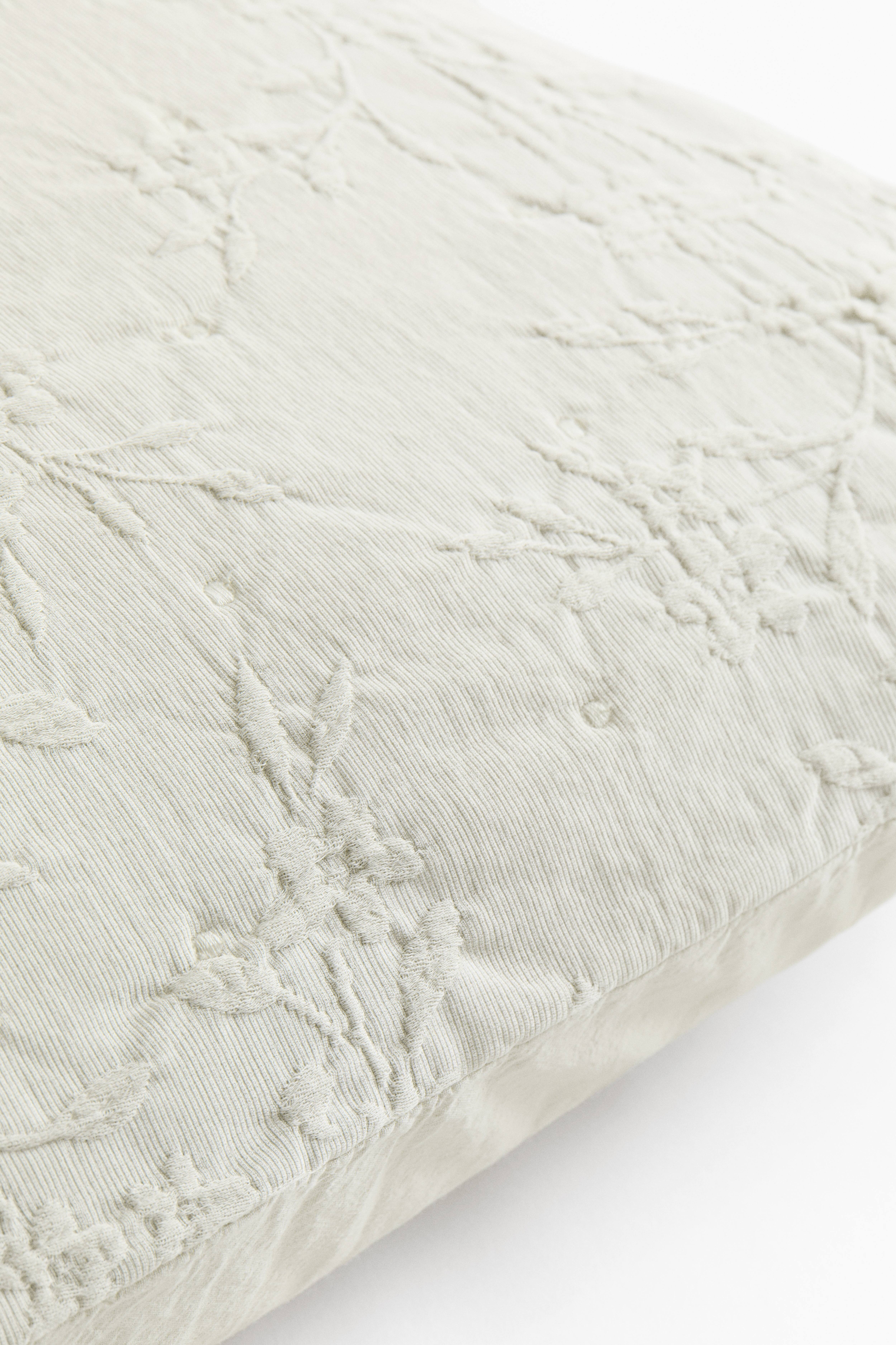 Housse de coussin en tissu jacquard