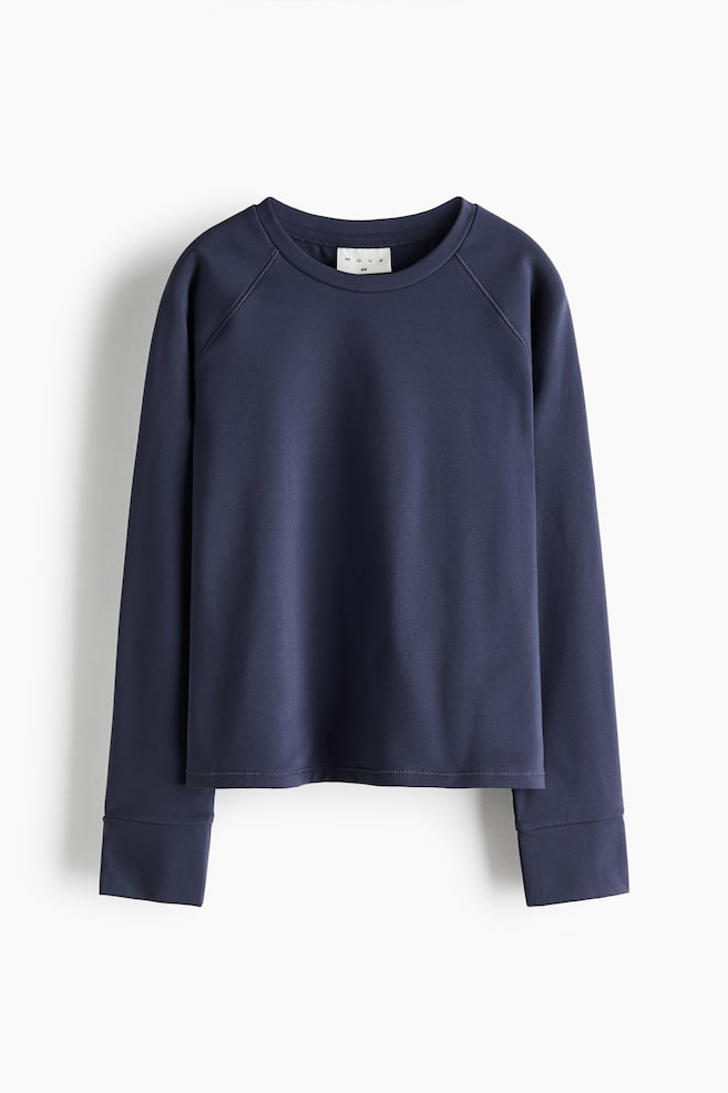 A dark navy blue sweatshirt is shown from the front, featuring a crew neck, raglan sleeves, and wide cuffs. The top is displaying a smooth, clean texture with a straight, double-stitched hem. - 1
