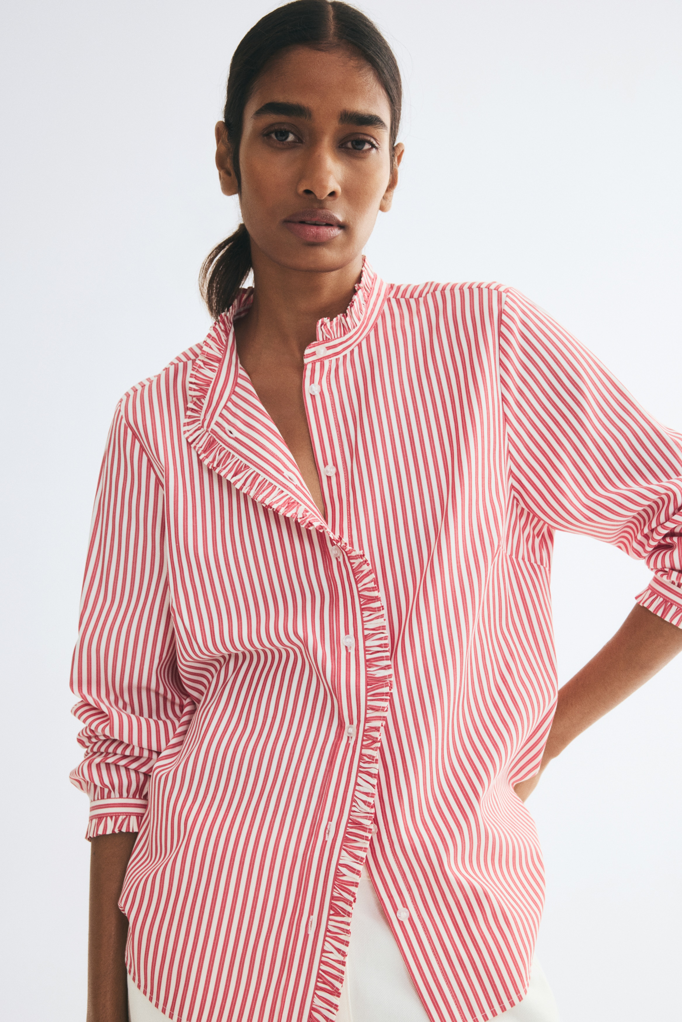 Frill-trimmed button-front blouseModel