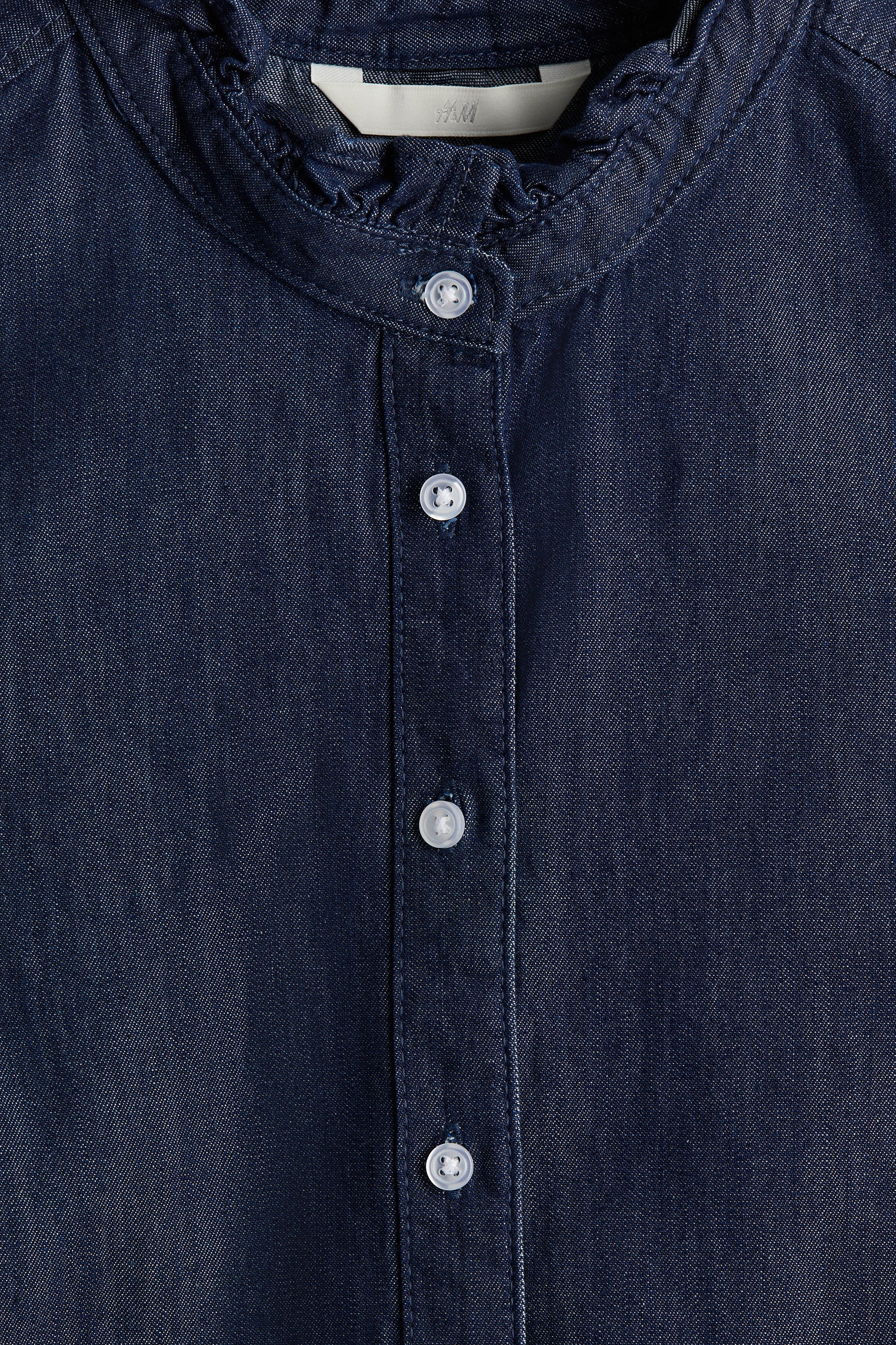 Frill-trimmed denim blouse