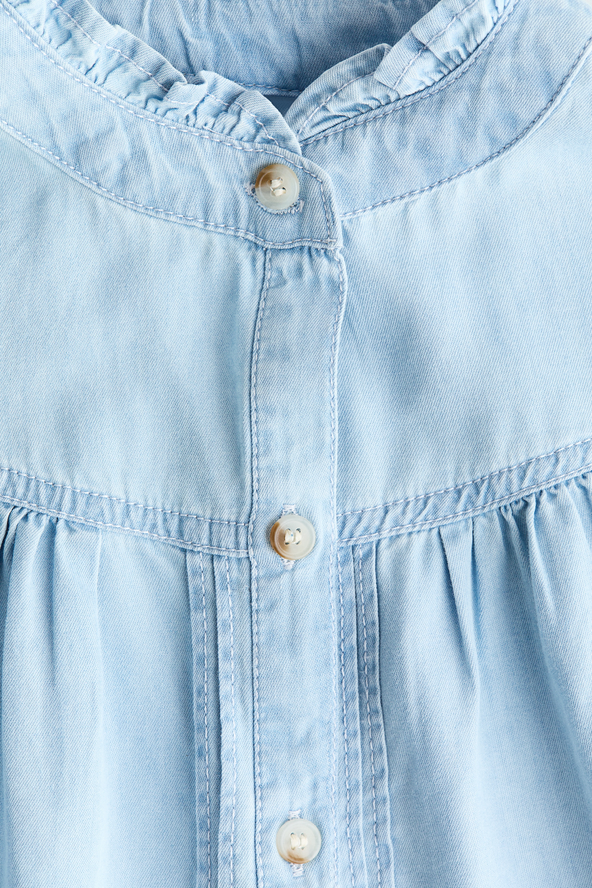 Frill-trimmed denim blouse