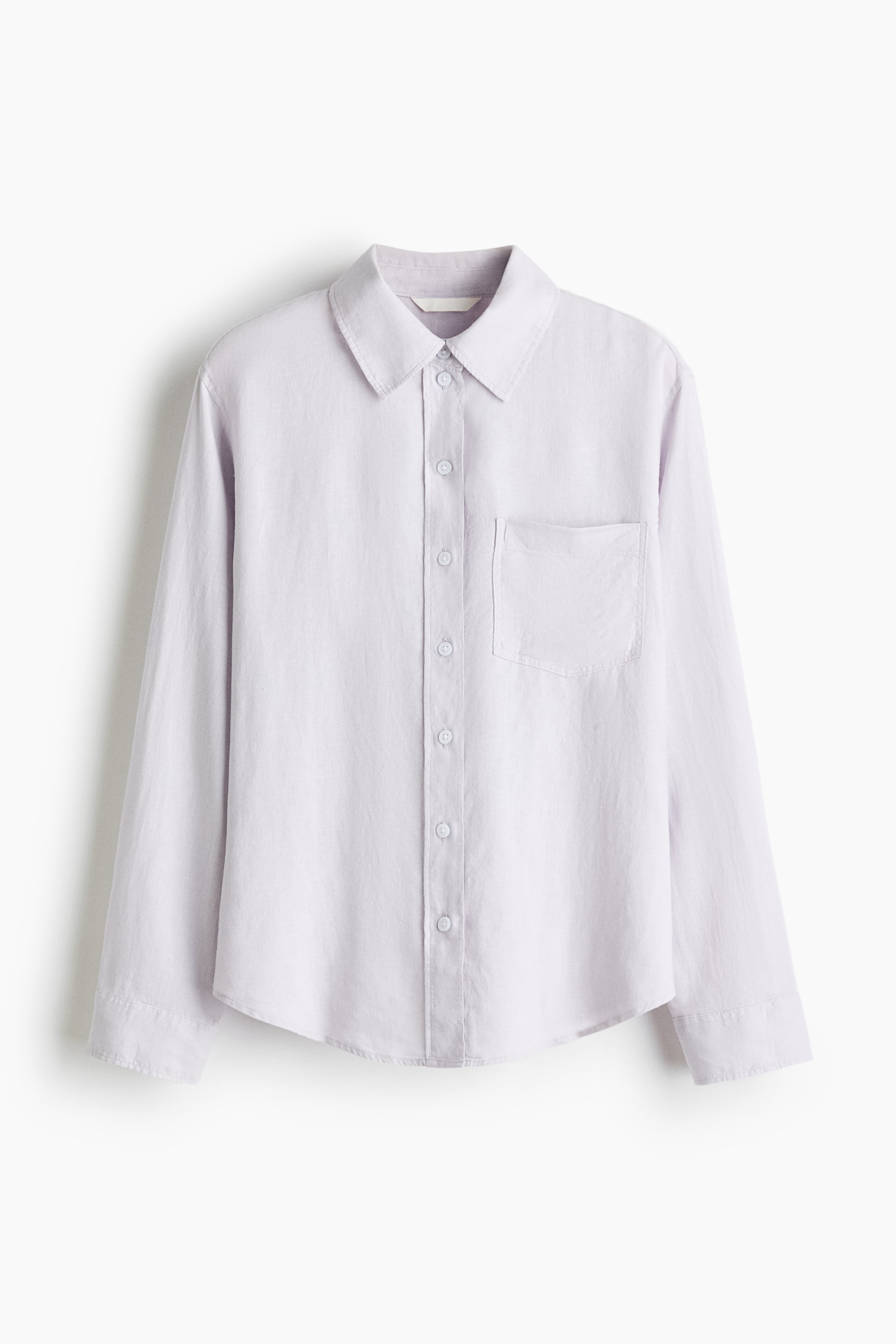 View larger image: The shirt is displayed front-facing, showcasing a collar, buttons running down the front, an open chest pocket, long sleeves with buttoned cuffs, and a curved hemline.