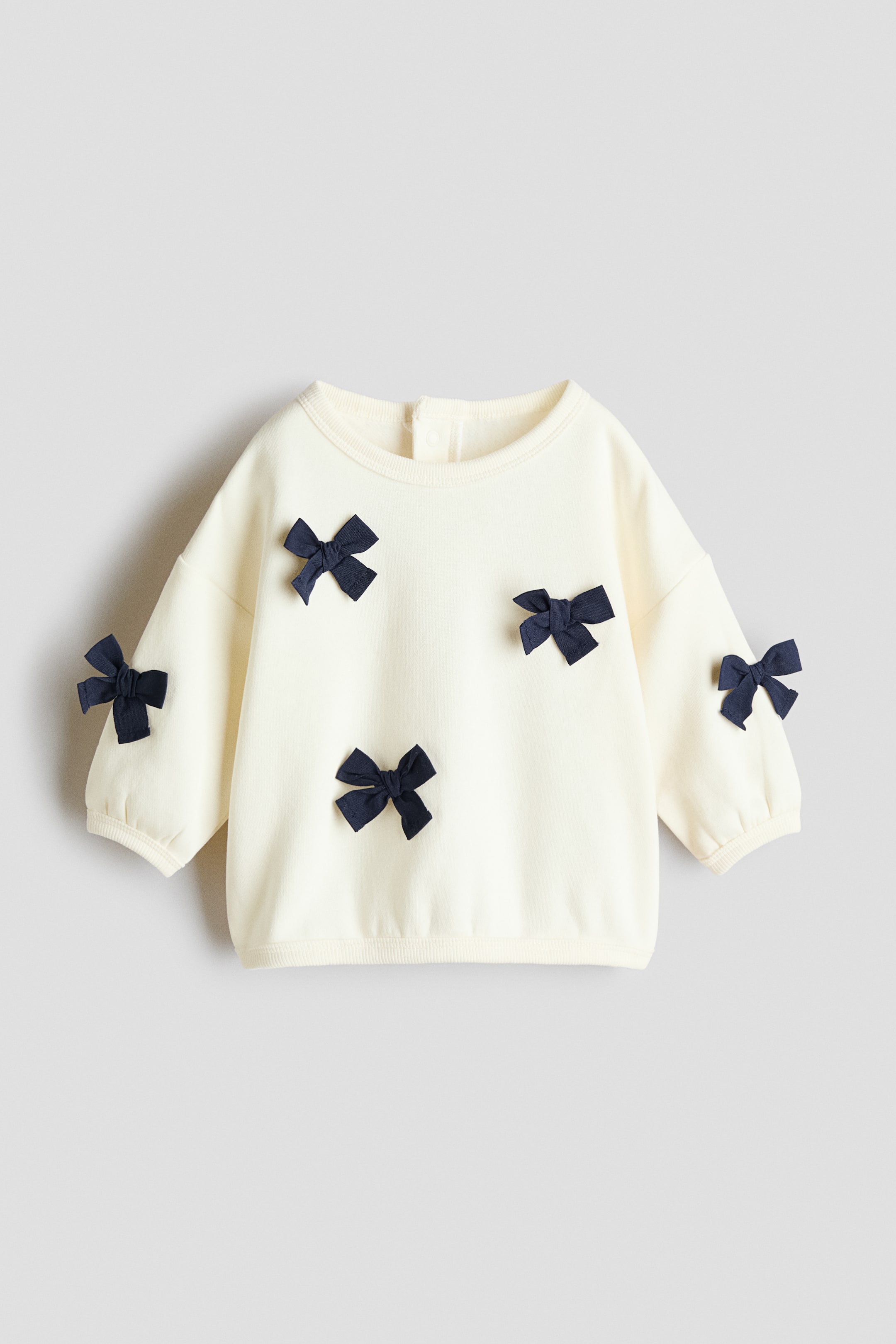 View larger image: Motif-detail sweatshirt - Cream/Bows - Kids | H&M 1