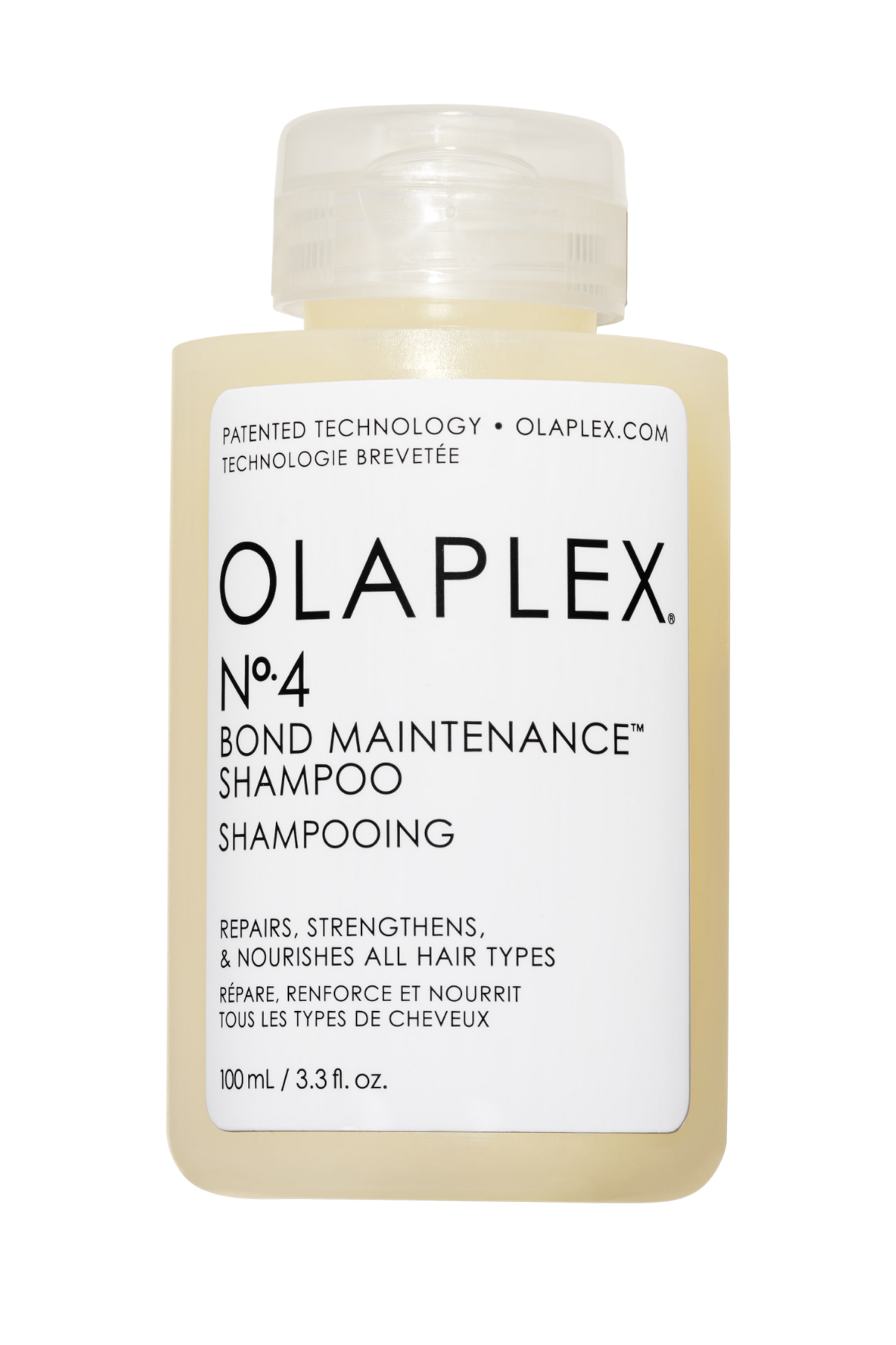 Visa större bild: En flaska Olaplex No. 4 Bond Maintenance Shampoo står framåtvänd. Det är en ljus krämfärgad flaska med en vit etikett med produktinformation och ett genomskinligt, räfflat flip-top lock.