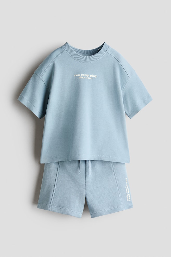 2-Piece T-Shirt and Shorts Set - Light dusty blue/Run/Light beige/Run Jump Play - 1