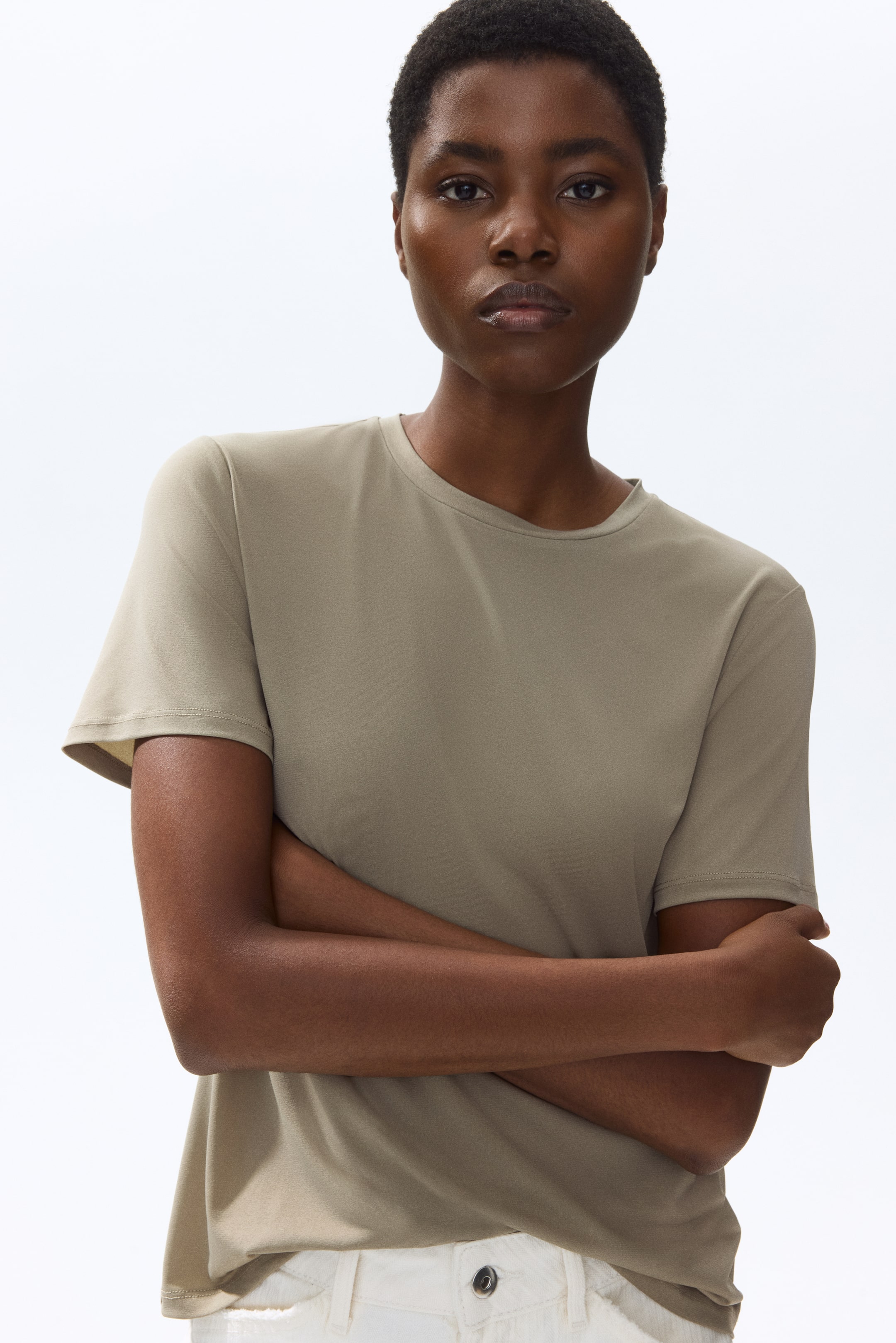 View larger image: A light olive green crew neck t-shirt features short sleeves and a smooth texture, with its front facing forward and displaying a regular fit.